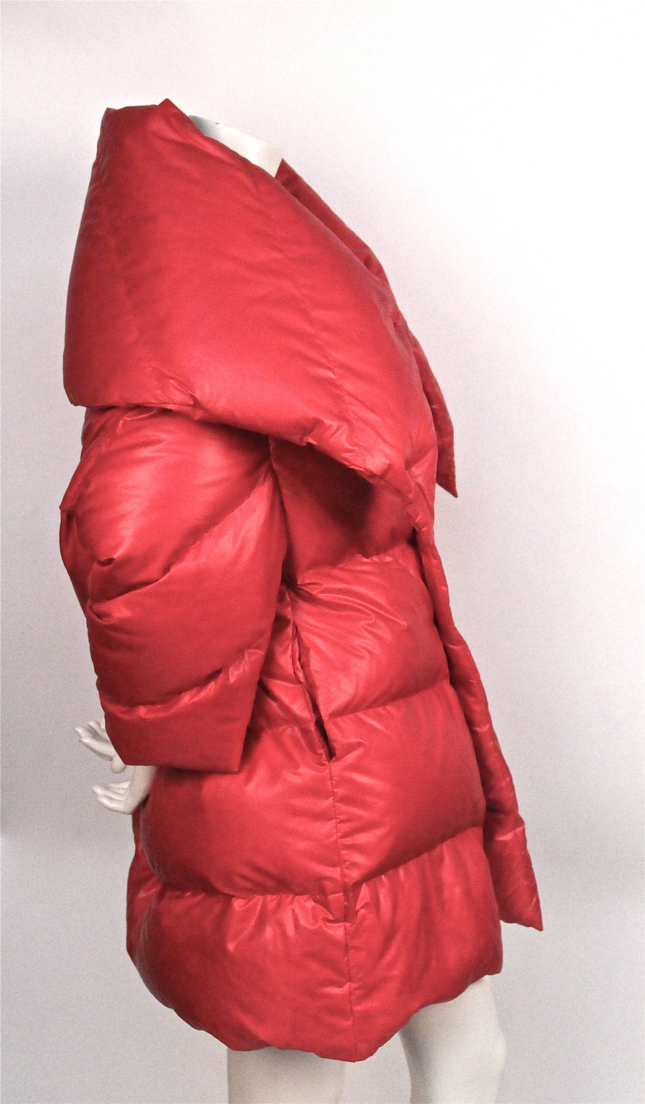 Vivid red quilted puffer style coat with exaggerated collar from Junya Watanabe for Comme des Garcons dating to fall of 2004. Similar style seen on the runway. The coat is labeled a size 'S' but will fit a medium as well due to the oversized cut. 