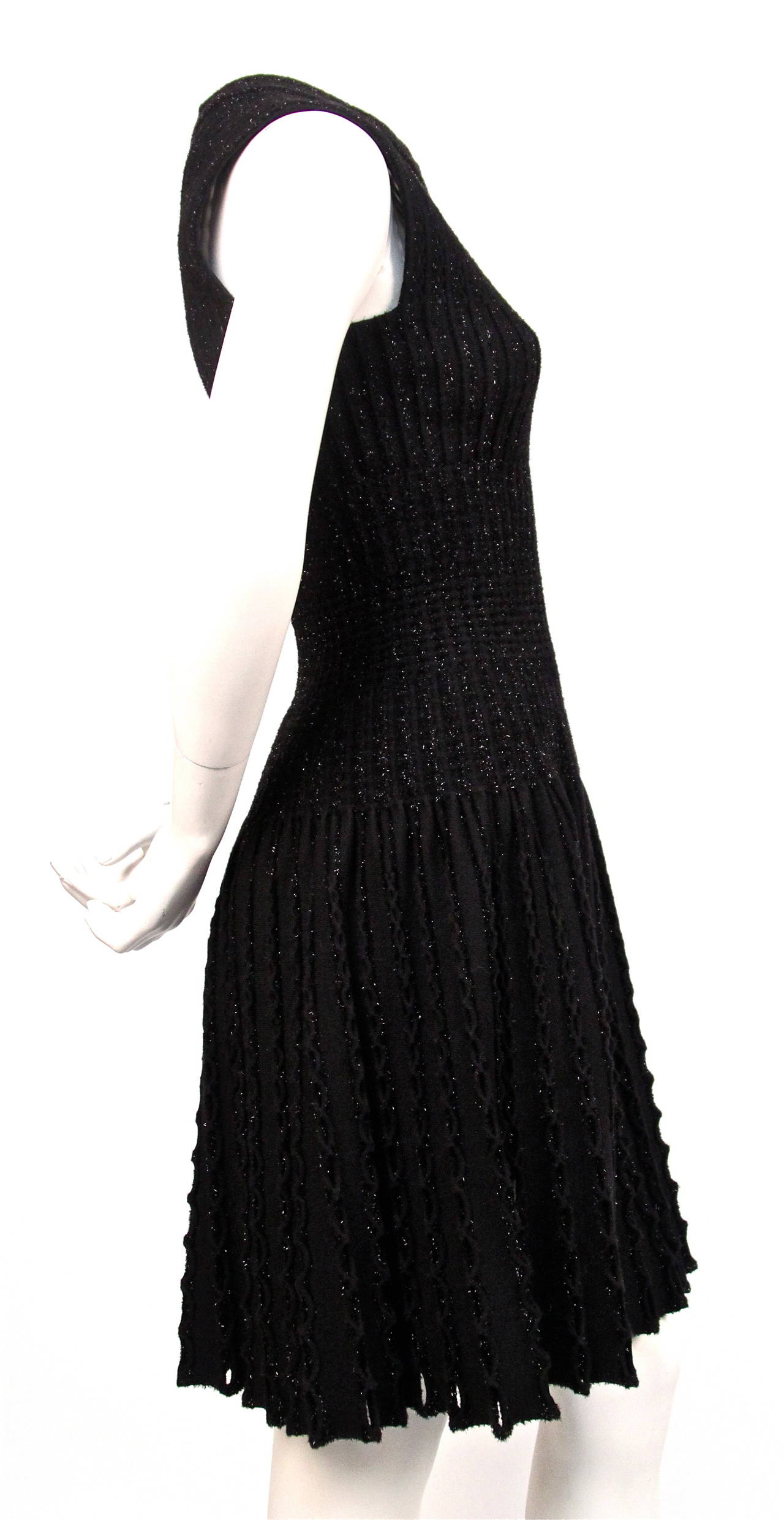 Jet black lurex knit dress with cut outs from Azzedine Alaia from a recent collection. French size 38. Approximate measurements: bust 30