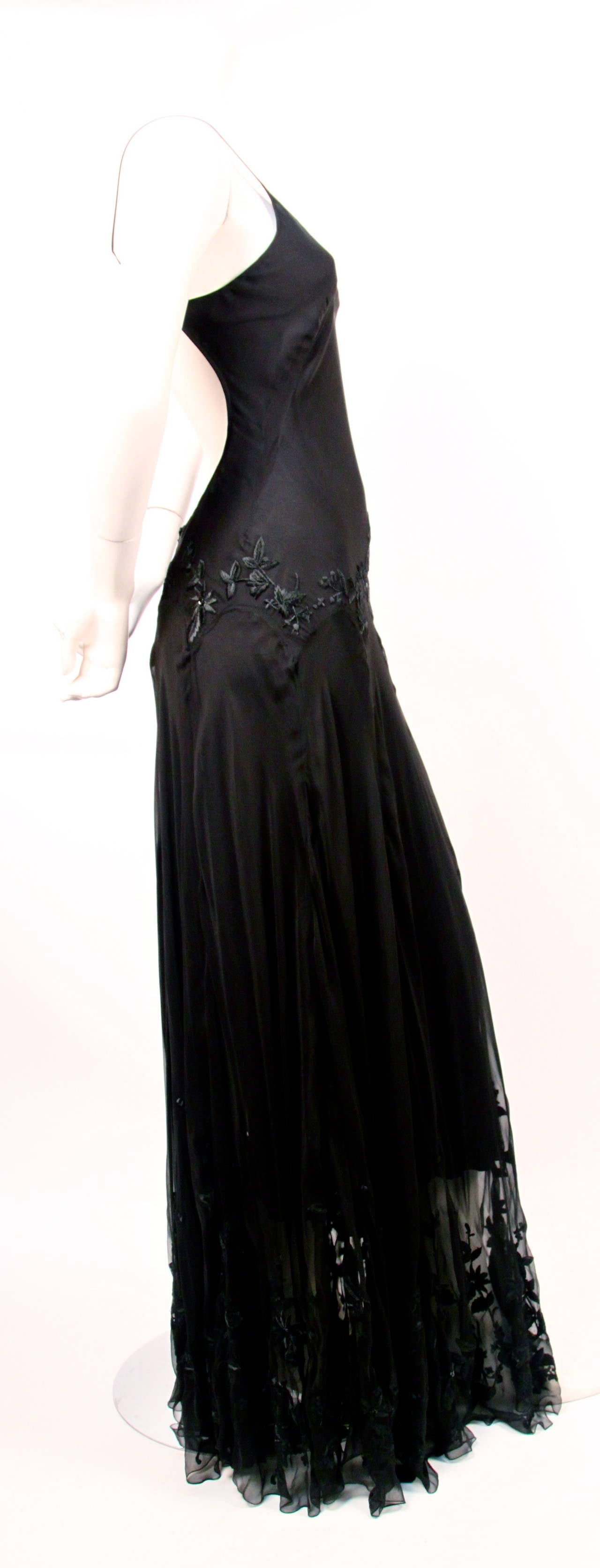 Jet black silk bias cut gown with black floral embroidery and sequins from Alexander McQueen dating to 2004. Italian size 40. Best fits a US 4. Length is about 60