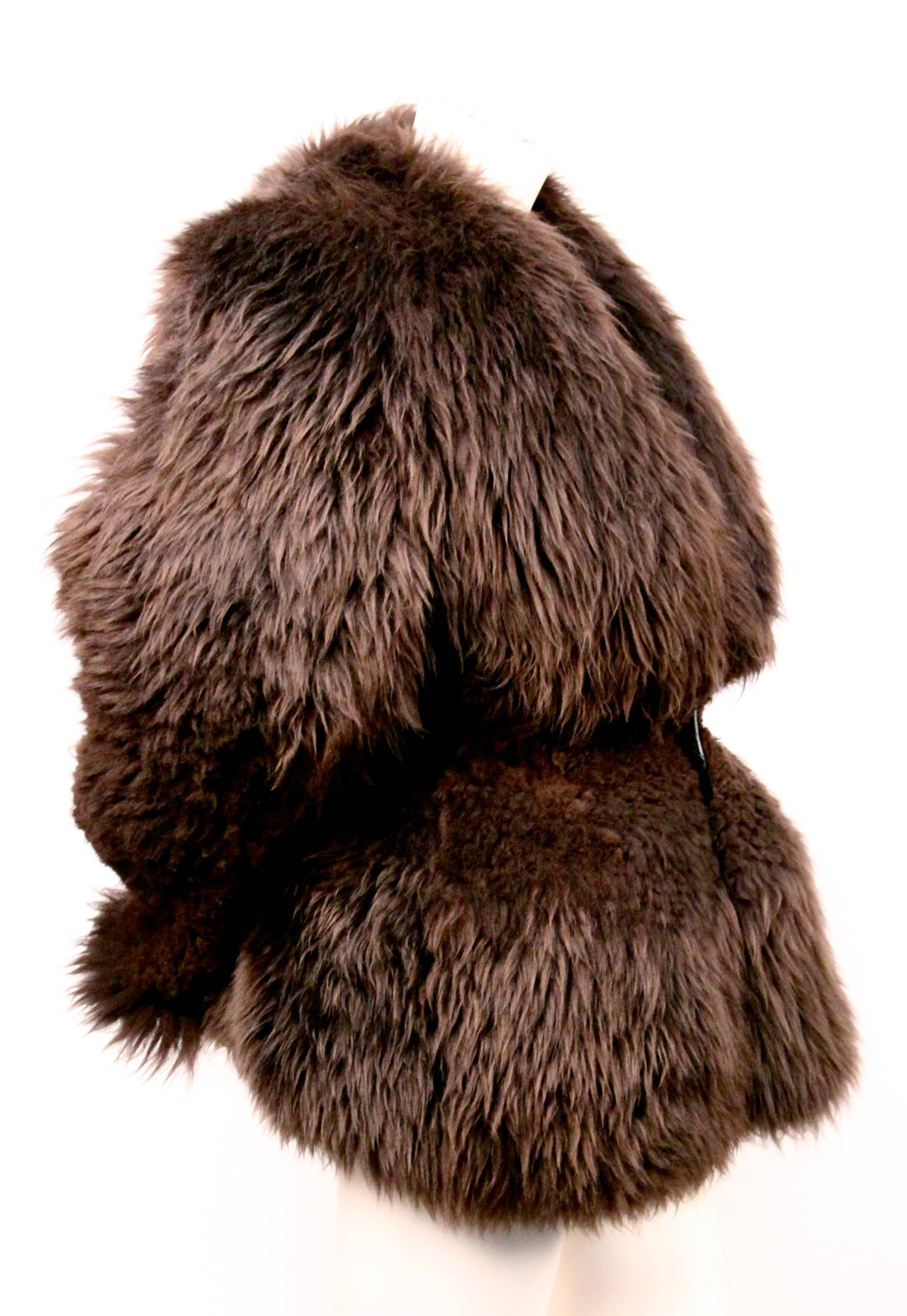 Very rare sculpted hourglass shaped shearling fur coat designed by Rick Owens dating to fall of 1999/2000. Made entirely of dense, hand sculpted and hand sheared sheep fur. Single button closure. Fits a size 4 or 6. Approximate measurements: