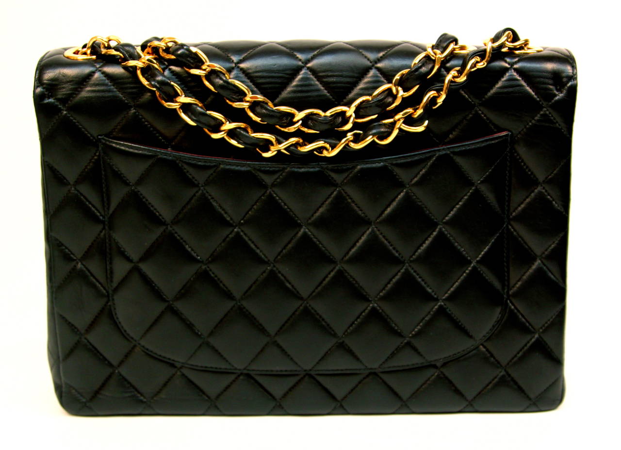Women's CHANEL black jumbo flap bag with woven leather & gilt metal chain strap