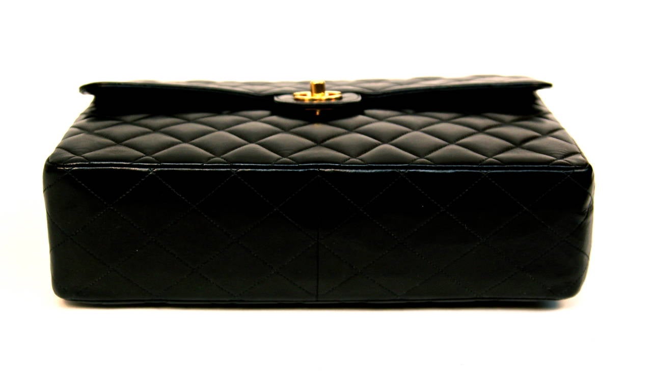 CHANEL black jumbo flap bag with woven leather & gilt metal chain strap 1