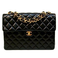 CHANEL black jumbo flap bag with woven leather & gilt metal chain strap