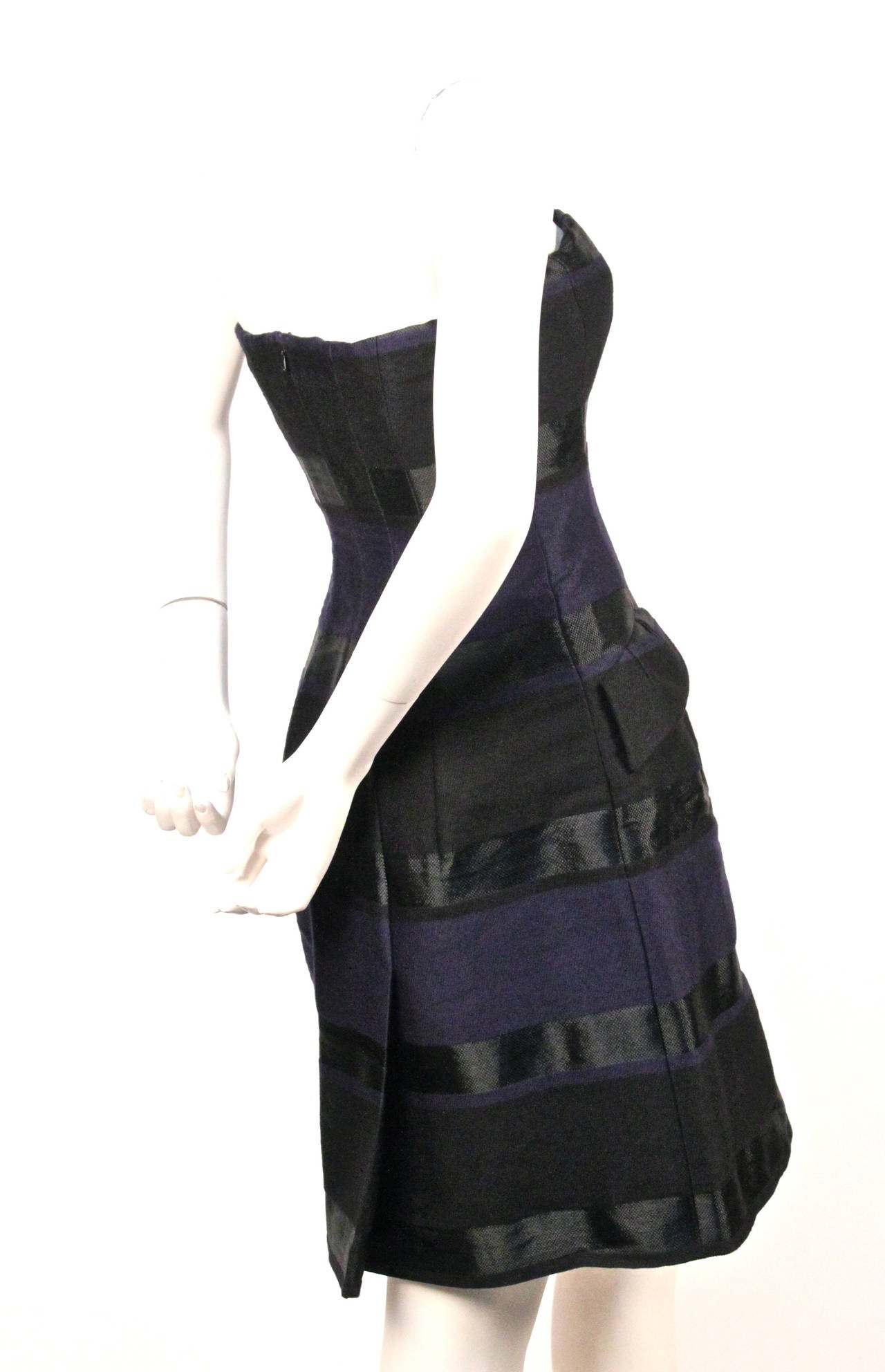 Strapless striped dress with corseted top designed by Raf Simons for Christian Dior dating to pre-fall of 2013. Labeled a French size 38. Approximate measurements: bust 32-33