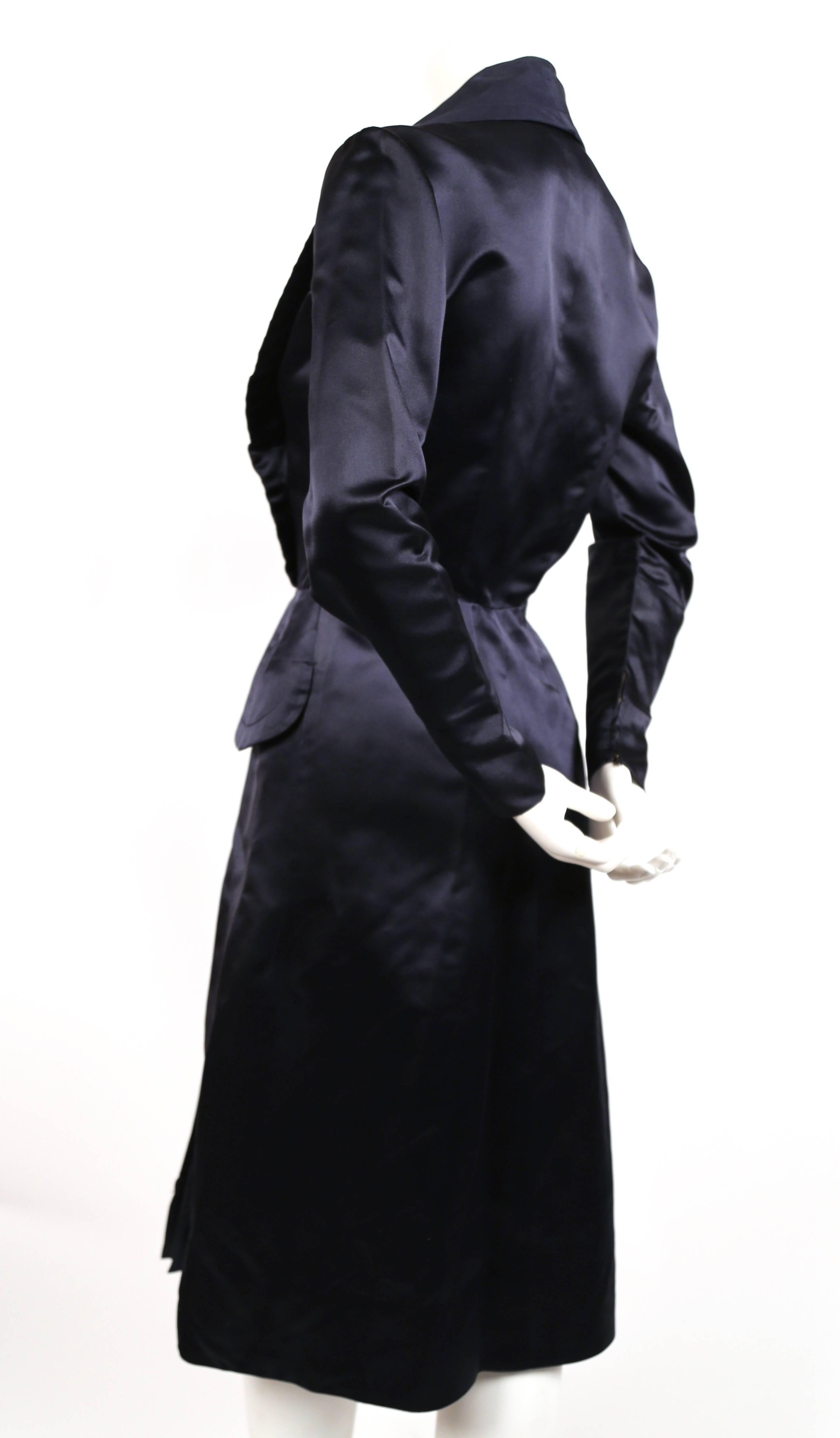 Very rare navy satin coat dress designed by Jacques Fath for Joseph Halpert dating to the 1940's. Best fits a size 4. Approximate measurements: shoulders 15