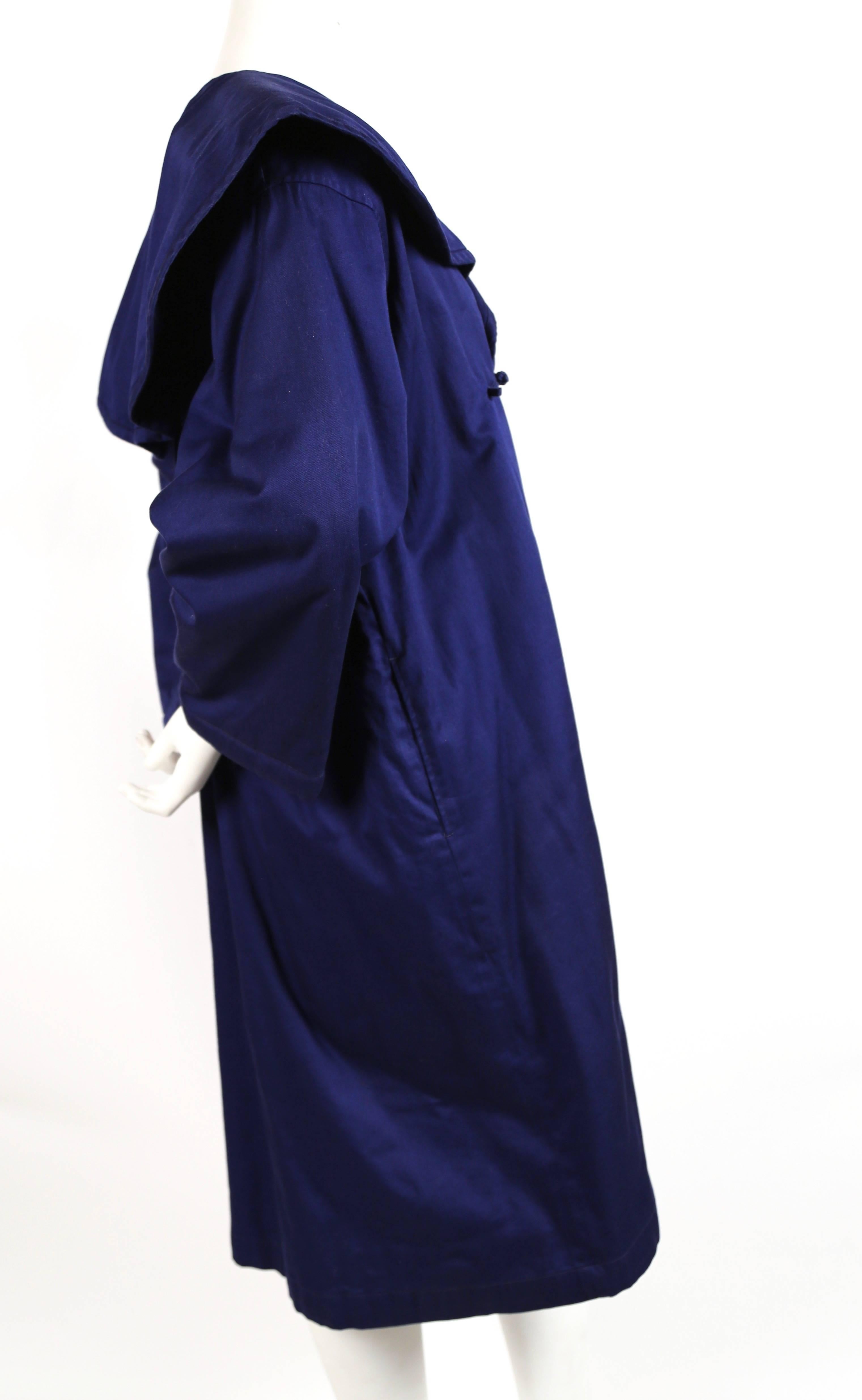 Vivid blue cotton coat with frog closures designed by Rei Kawakubo for Comme Des Garcons 'China' dating to the 1980's. No size is indicated however this has an oversized fit. Approximate measurements taken on outside of coat: shoulder 20