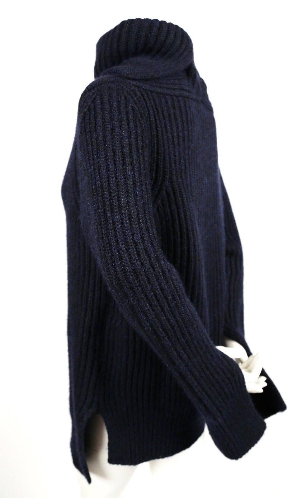 Oversized soft and fuzzy oversized navy blue cashmere and mohair sweater designed by Phoebe Philo for Celine.  This thick sweater has a split neck and split sleeves for an interesting fit. Labeled a French size S however the intended fit is very