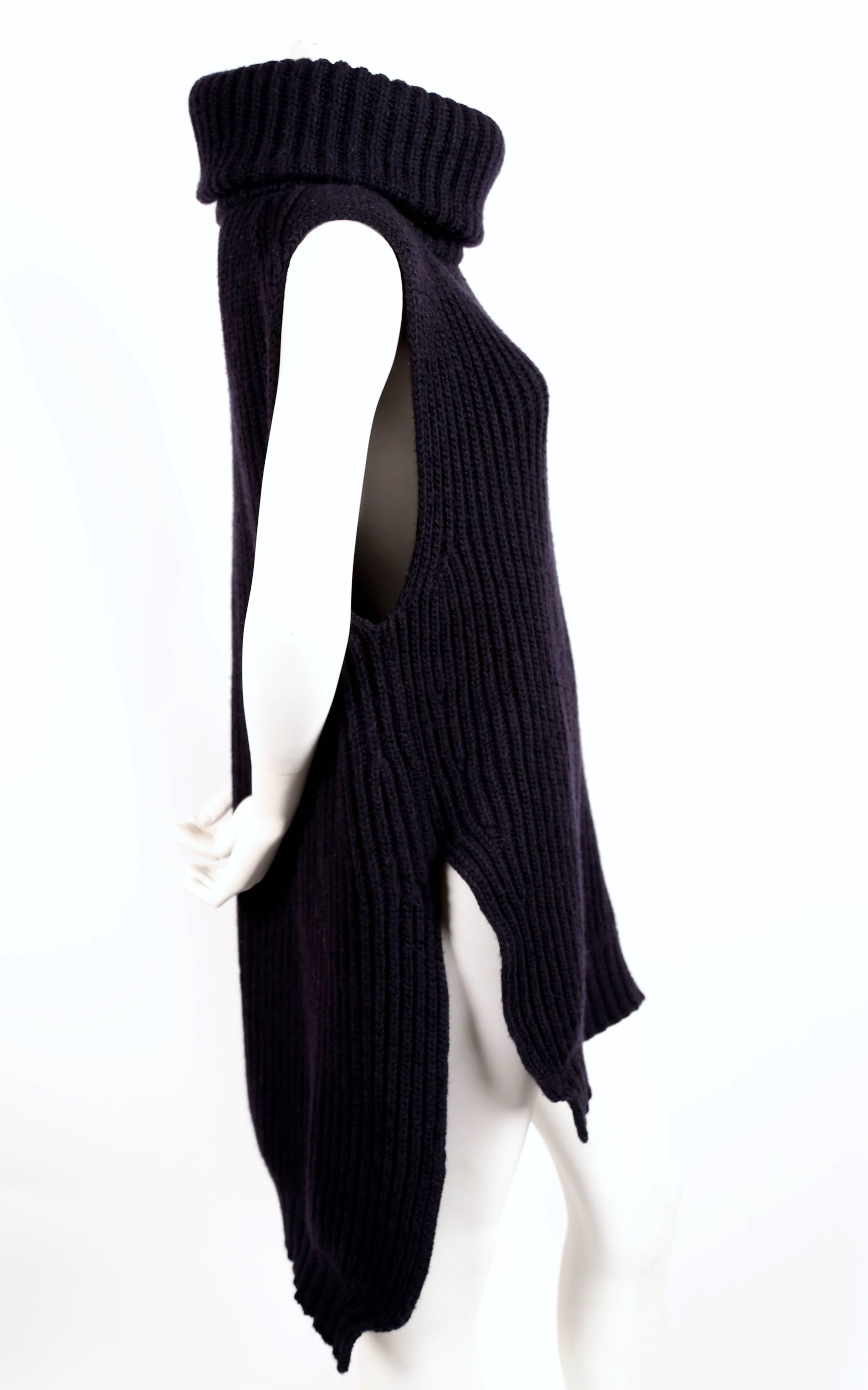 Deep navy blue tunic sweater designed by Phoebe Philo for Celine exactly as seen on the fall 2010 runway. Size 'M'. Approximate measurements: shoulder 18", bust 42", length in front 29-30" and length in back 35-36". Made in