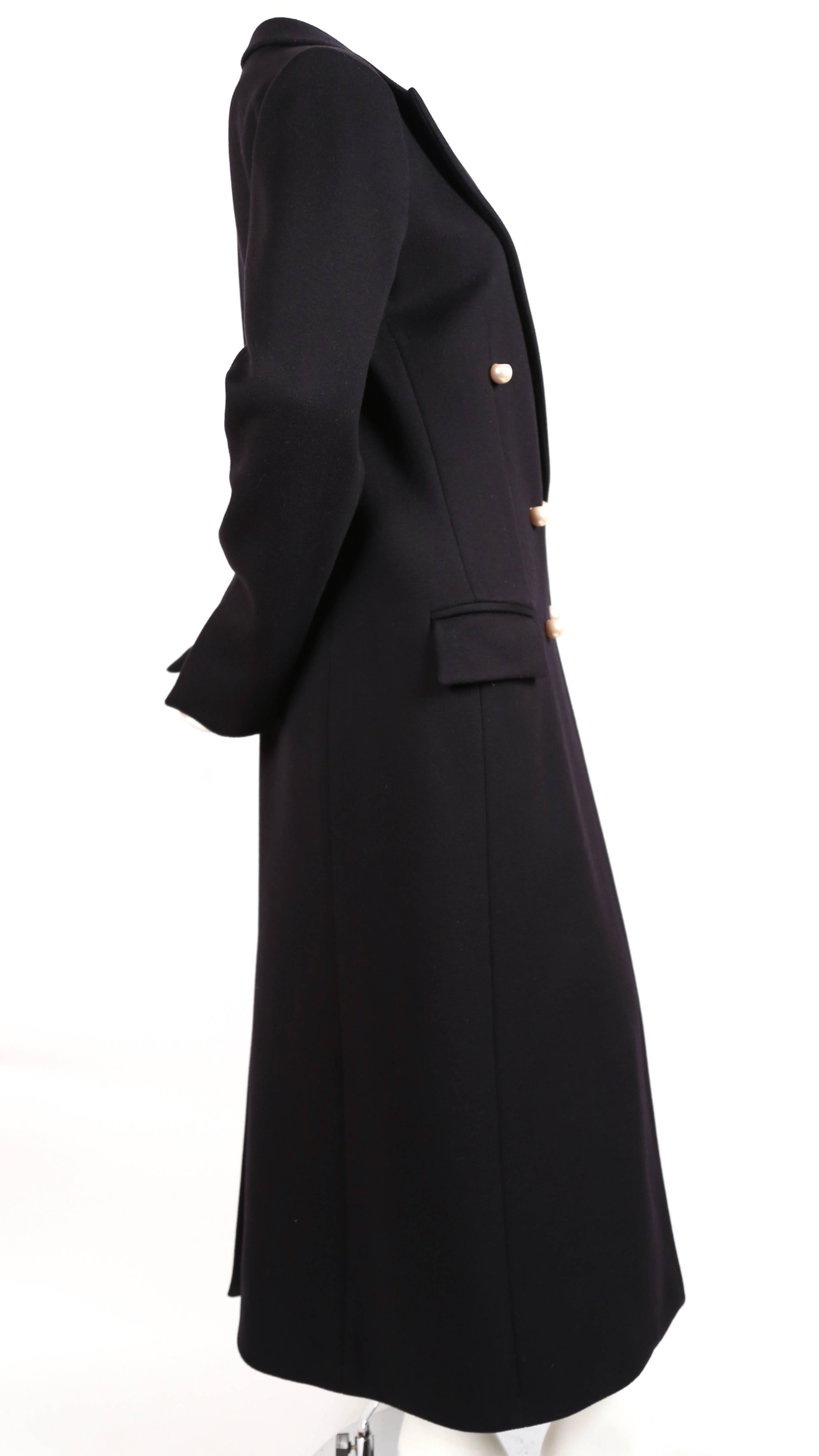 Darkest navy blue wool coat with oversized pearl buttons designed by Phoebe Philo for Celine exactly as seen for the pre-fall 2014 collection. French size 38. Approximate measurements: shoulders 17