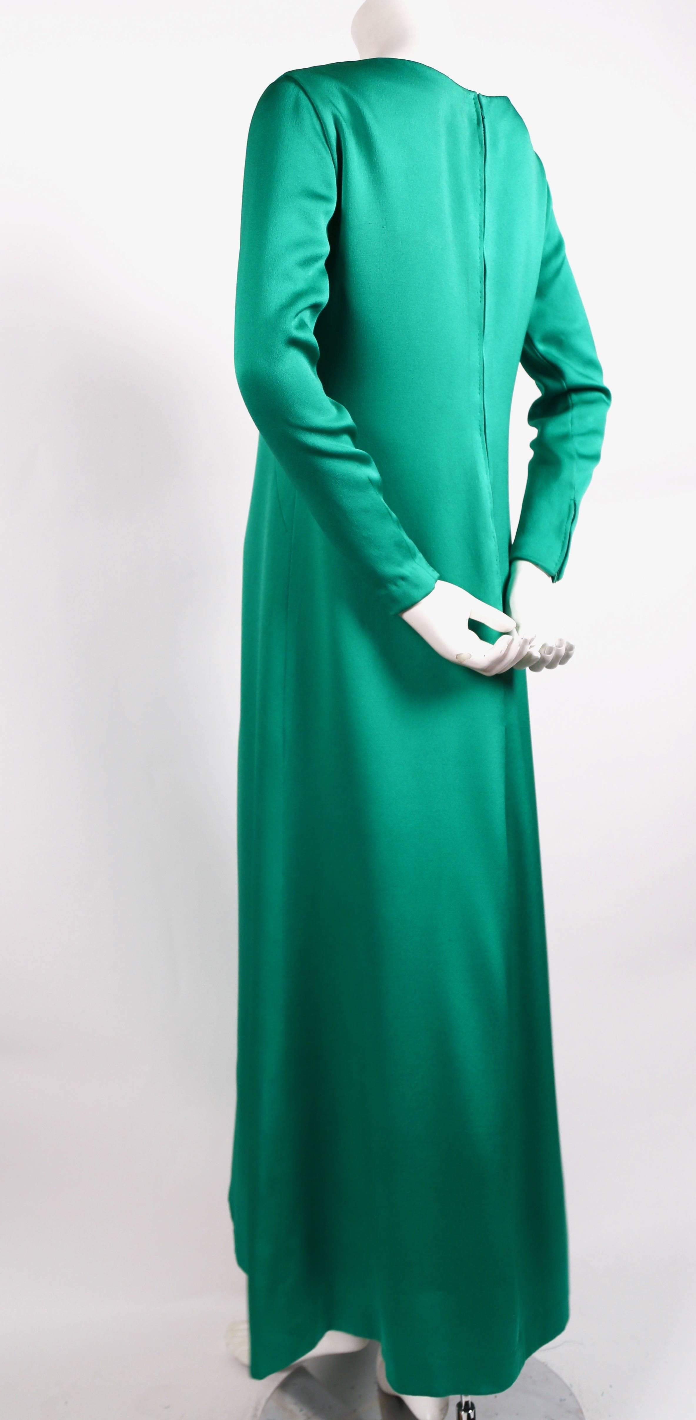 Rich, emerald-green, silk A-line gown designed by Givenchy dating to the 1960's.  Dress has a 'patron' label so this is most likely an authorized copy however the dress is extremely well made and shows couture detailing throughout.  Approximate