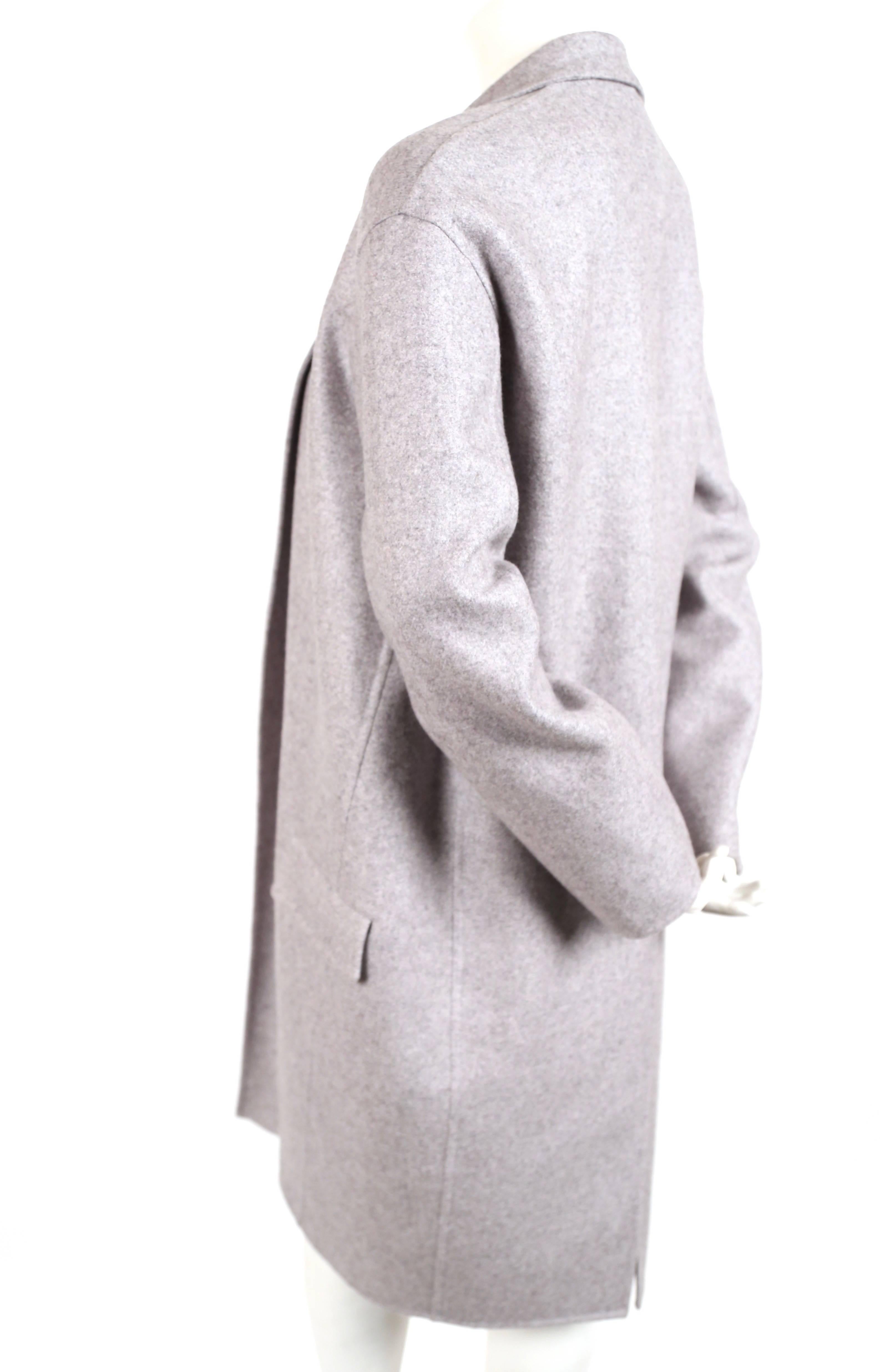 Very soft, heathered-grey colored cashmere coat in an 'egg shape' designed by Phoebe Philo for Celine. French size 34. Approximate measurements: drop shoulder 20