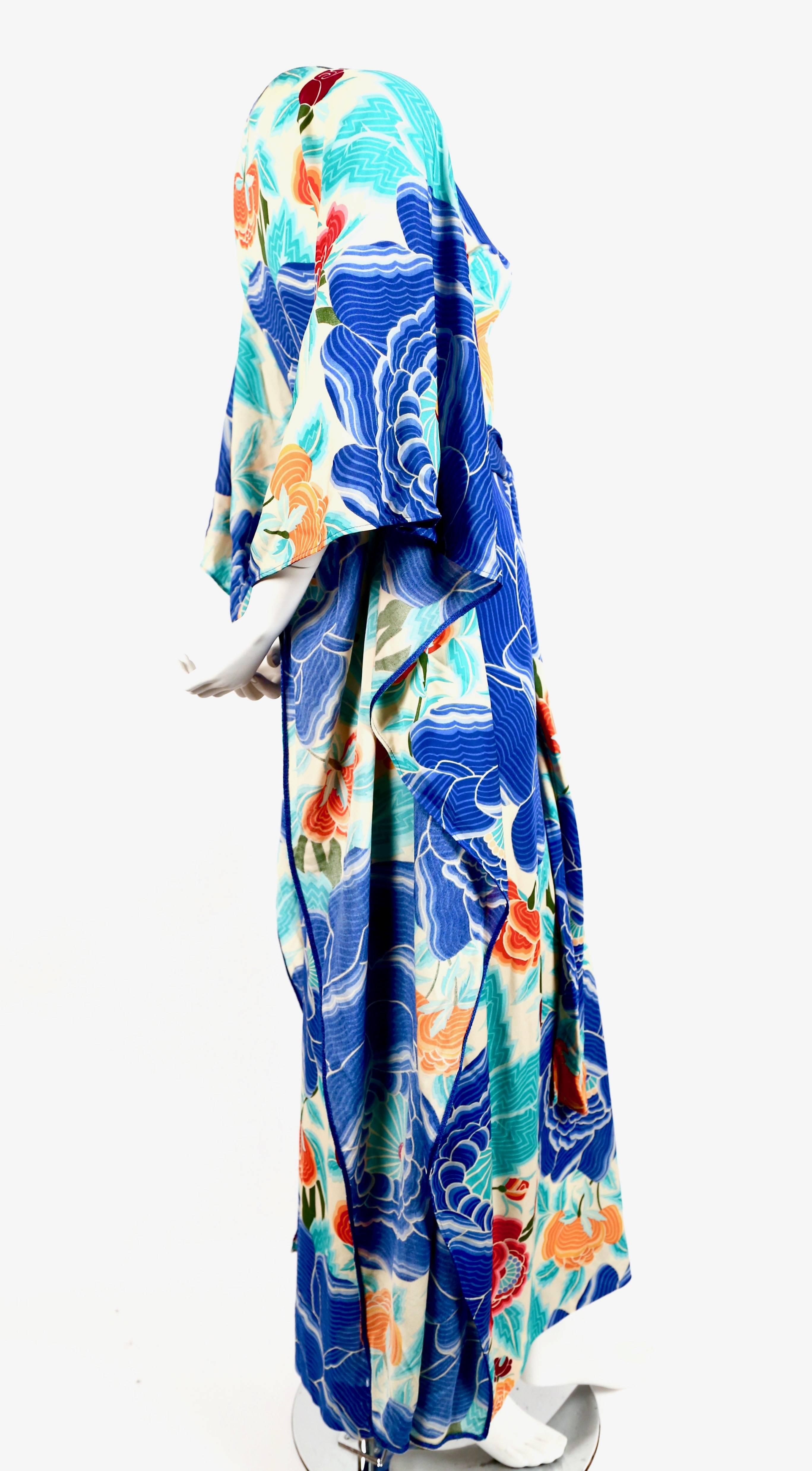 Dramatic silk jersey caftan from Missoni with floral motif dating to the early 1970's. Caftan is fitted to the body with cleverly placed seams. Belt threads through at waist. Slips on over the head. Best fits a size XS-M. Approximate measurements:
