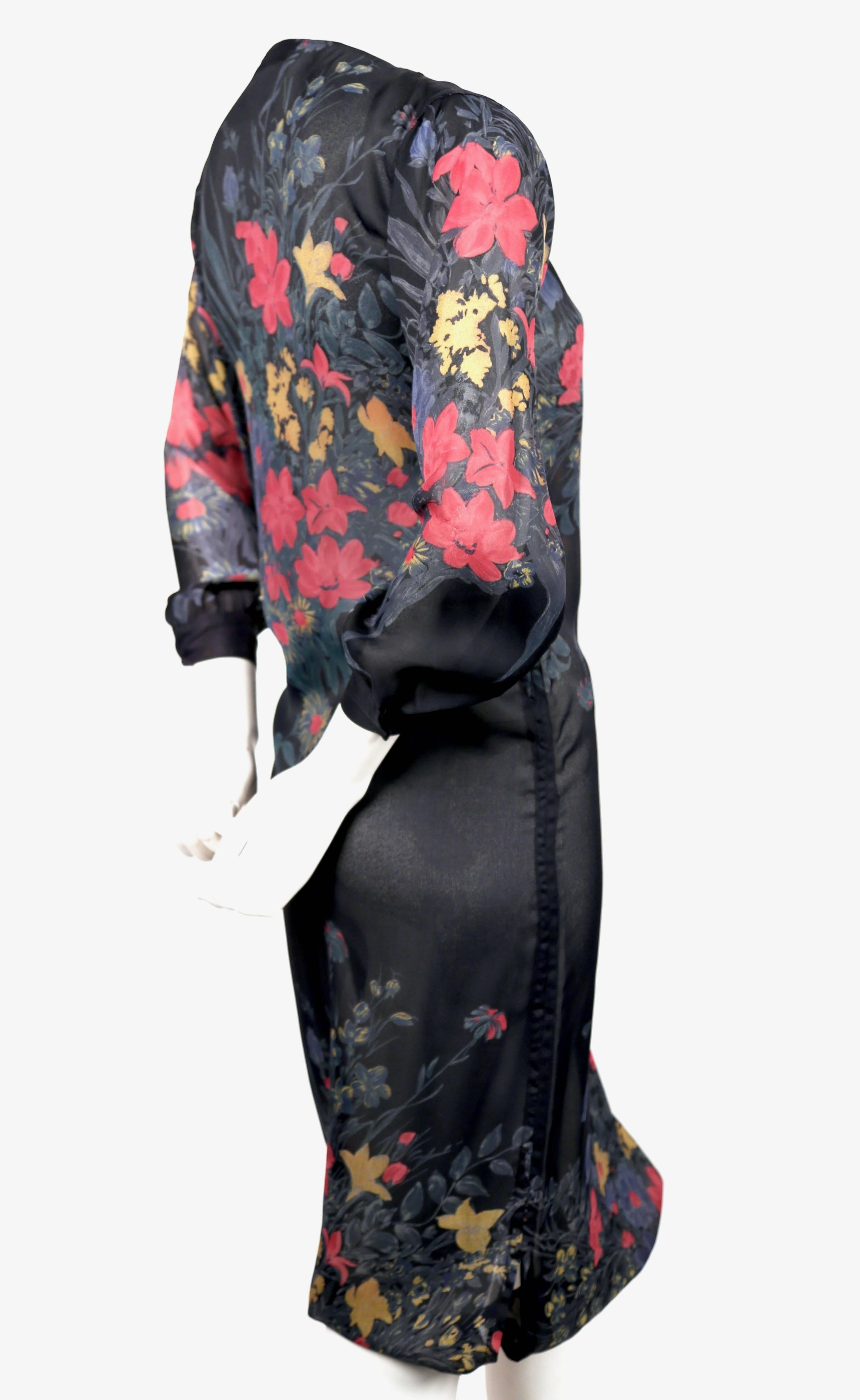 Semi-sheer, silk, floral printed dress with asymmetrically placed button collar and drawstring hemline deigned by Sonia Rykiel dating to the late 1970's. Fits a US 2 (34