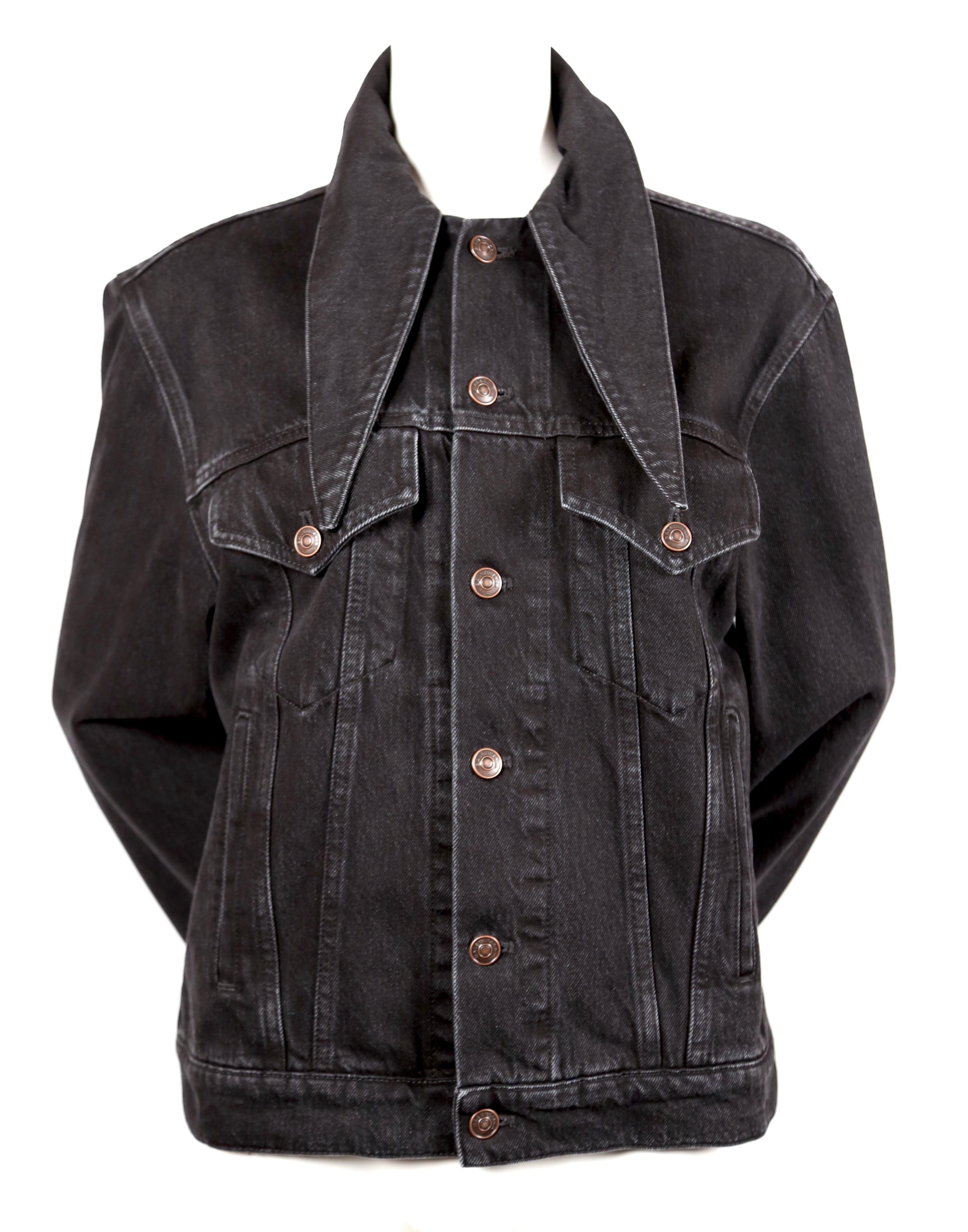 Long sleeve denim jacket in 'simple stonewash' black with scarf tie at collar designed by Demna Gvasalia for Balenciaga. French size 38. Approximate measurements: 18