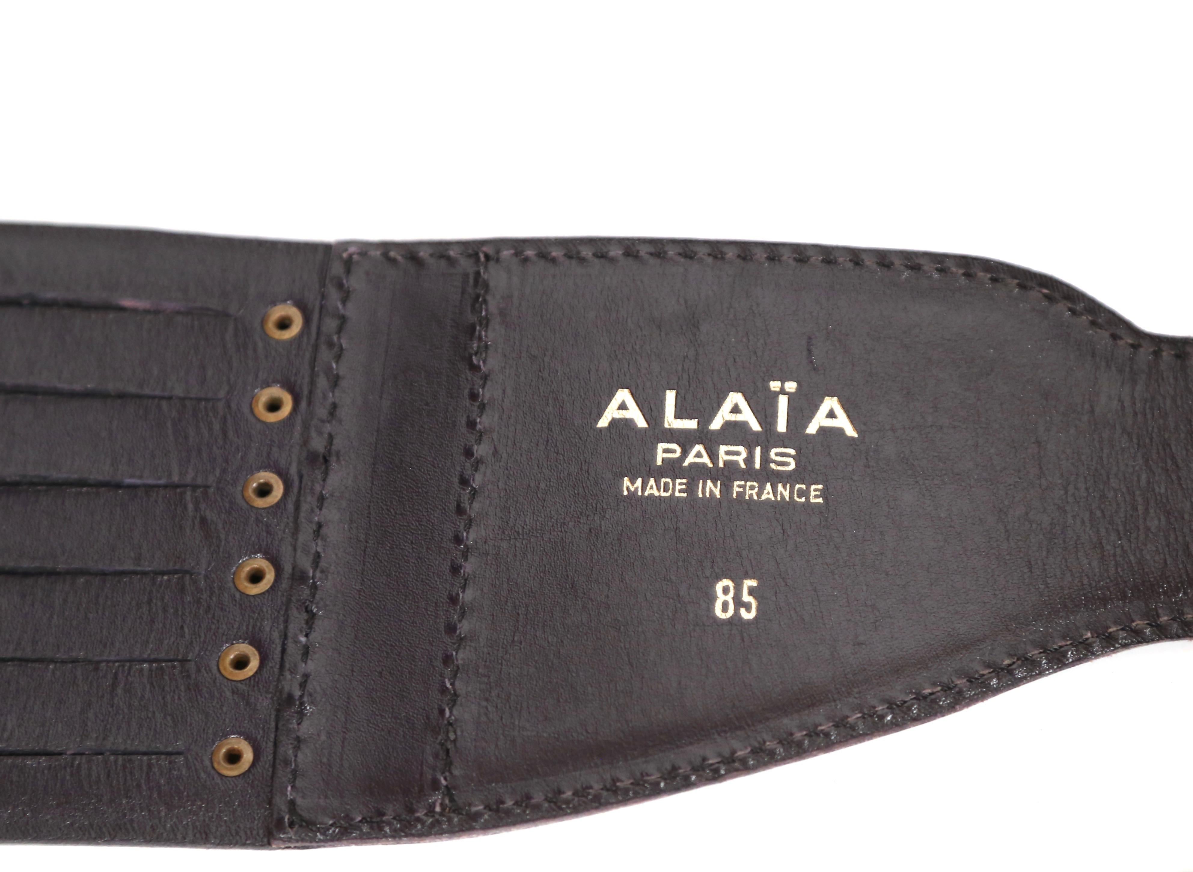 Midnight-blue leather corset belt from Alaia dating to the 1990's. French size 85, which best fits a 30-33