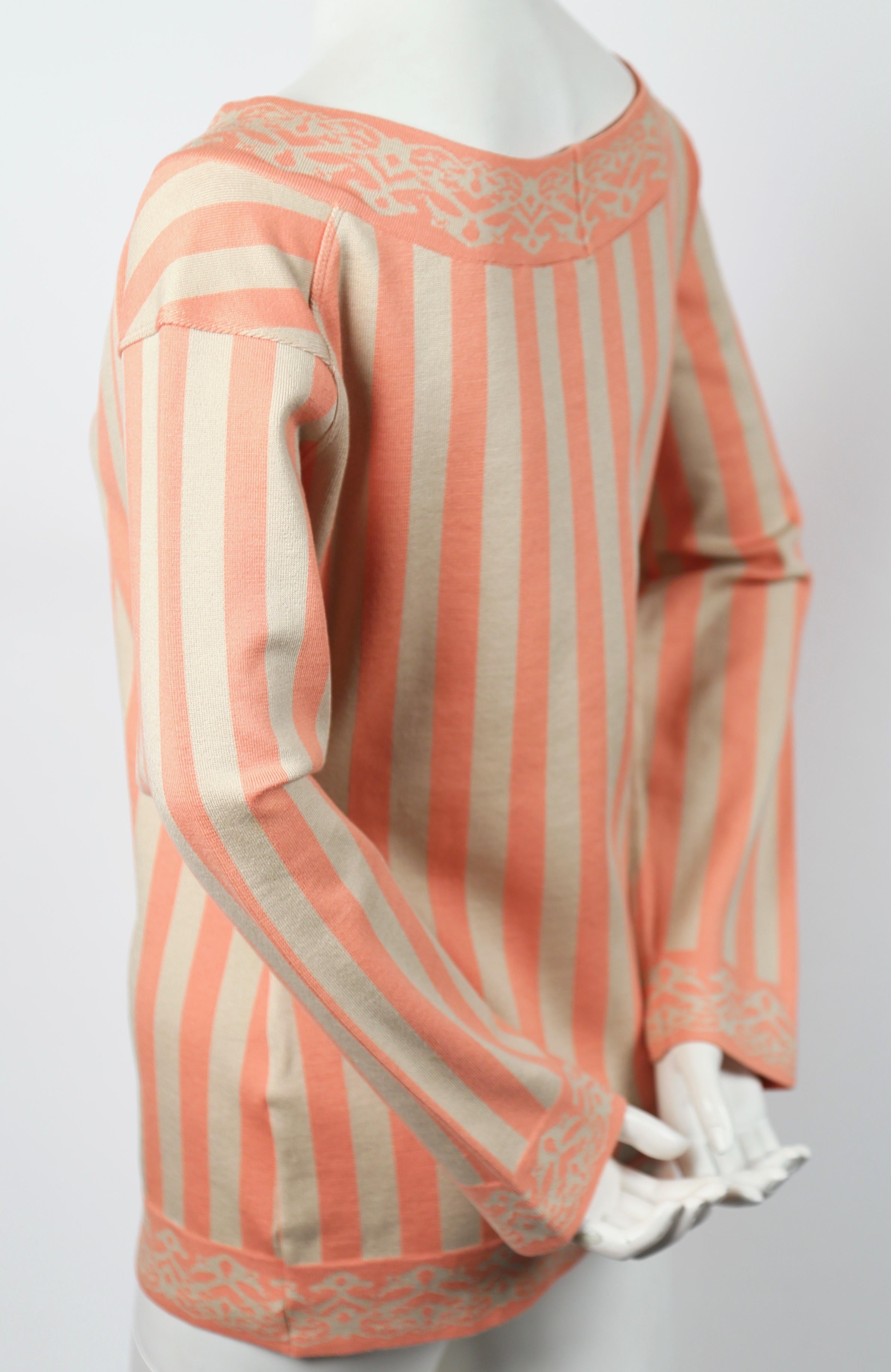 Peach and tan striped tunic sweater designed by Azzedine Alaia dating to spring 1992 as seen on the runway. Size S. Approximate measurements: drop shoulder 19.5