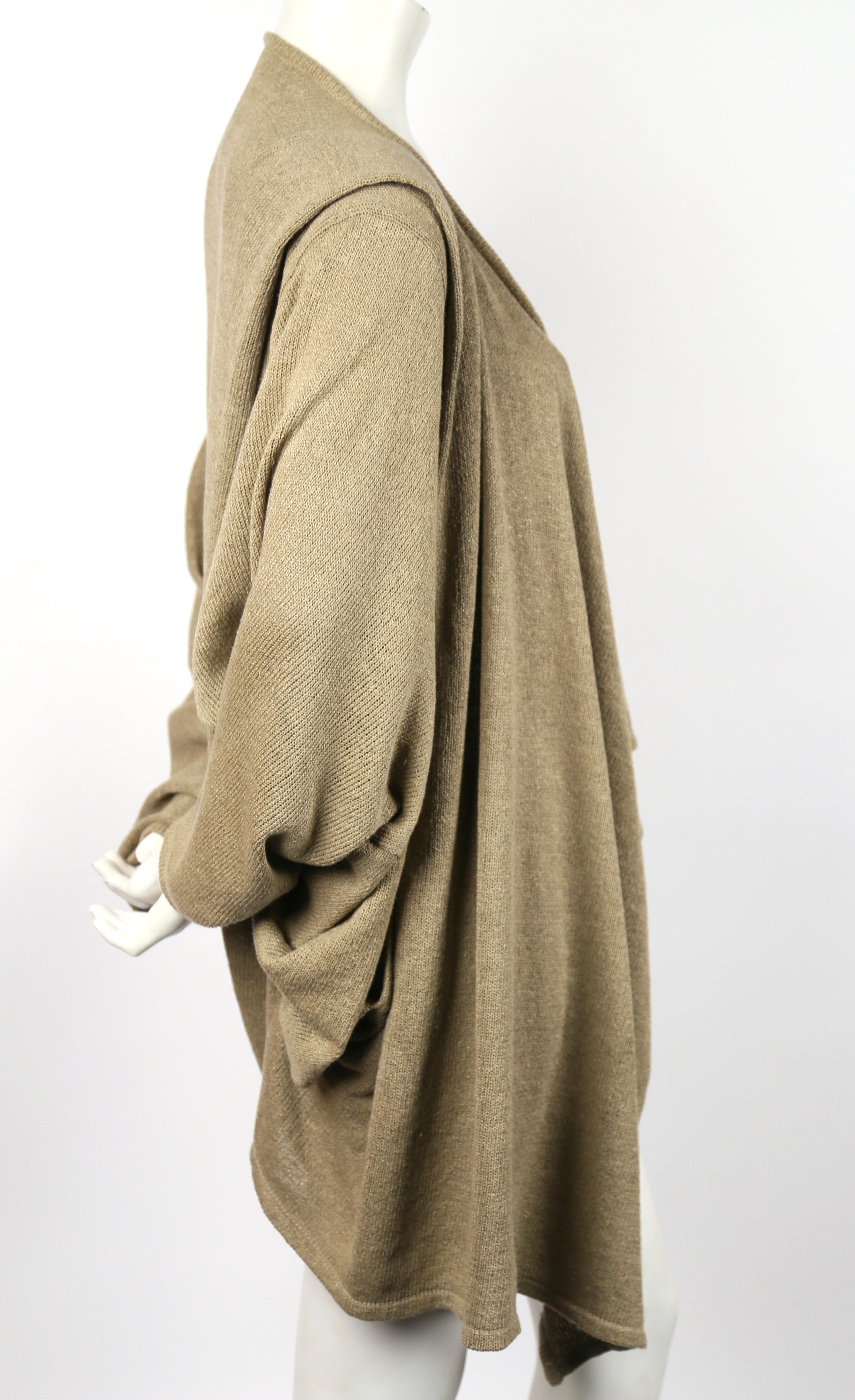 Draped tan cardigan jacket designed by Issey Miyake dating to the 1980's. Fits most sizes due to the oversized cut. Length is approximately 40