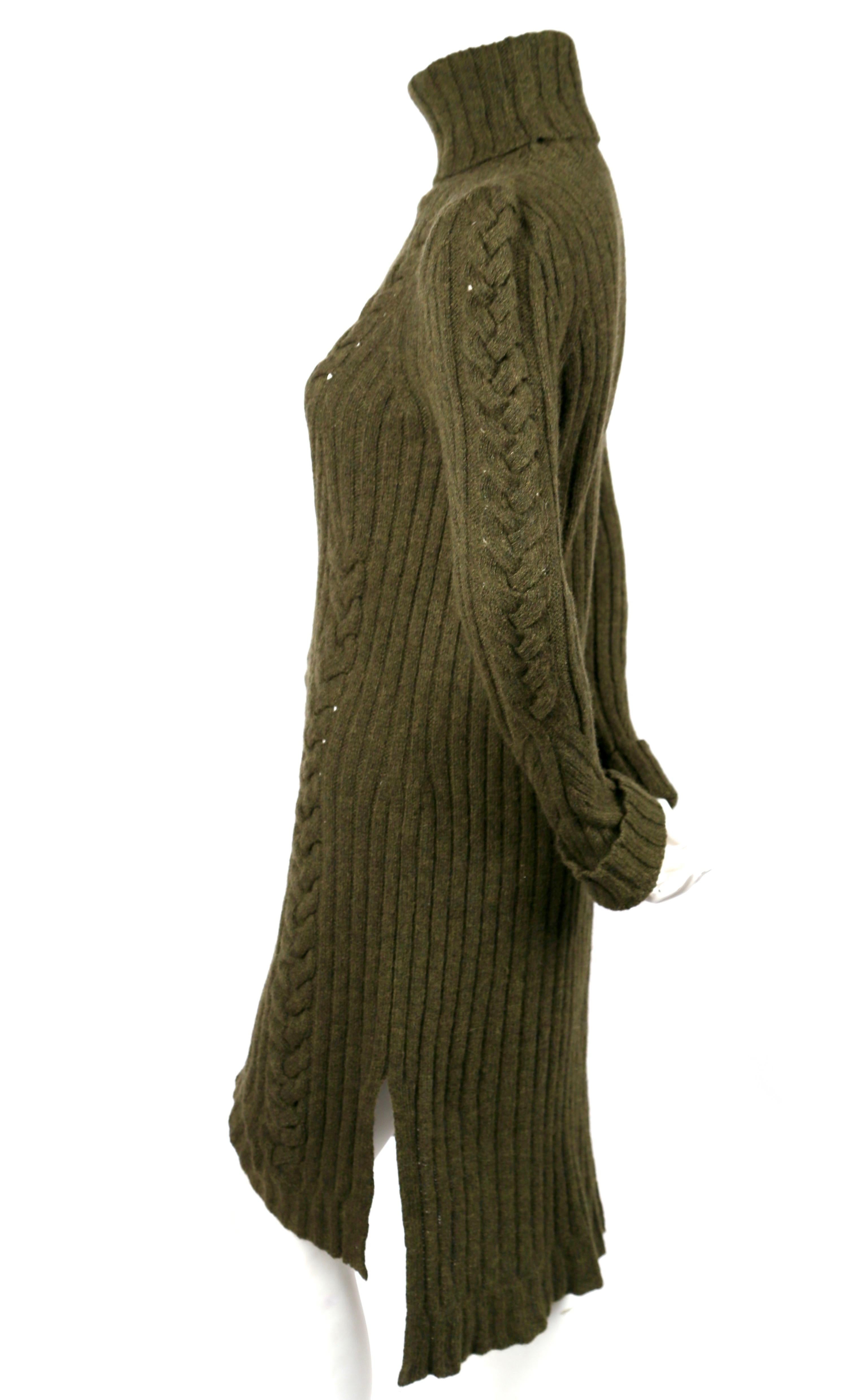 Moss Green cable-knit sweater dress designed by Phoebe Philo for Celine for the pre fall 2010 collection. Can be worn as a sweater or dress. No size is indicated however this best fits a S-M. Approximate measurements (unstretched laying flat):