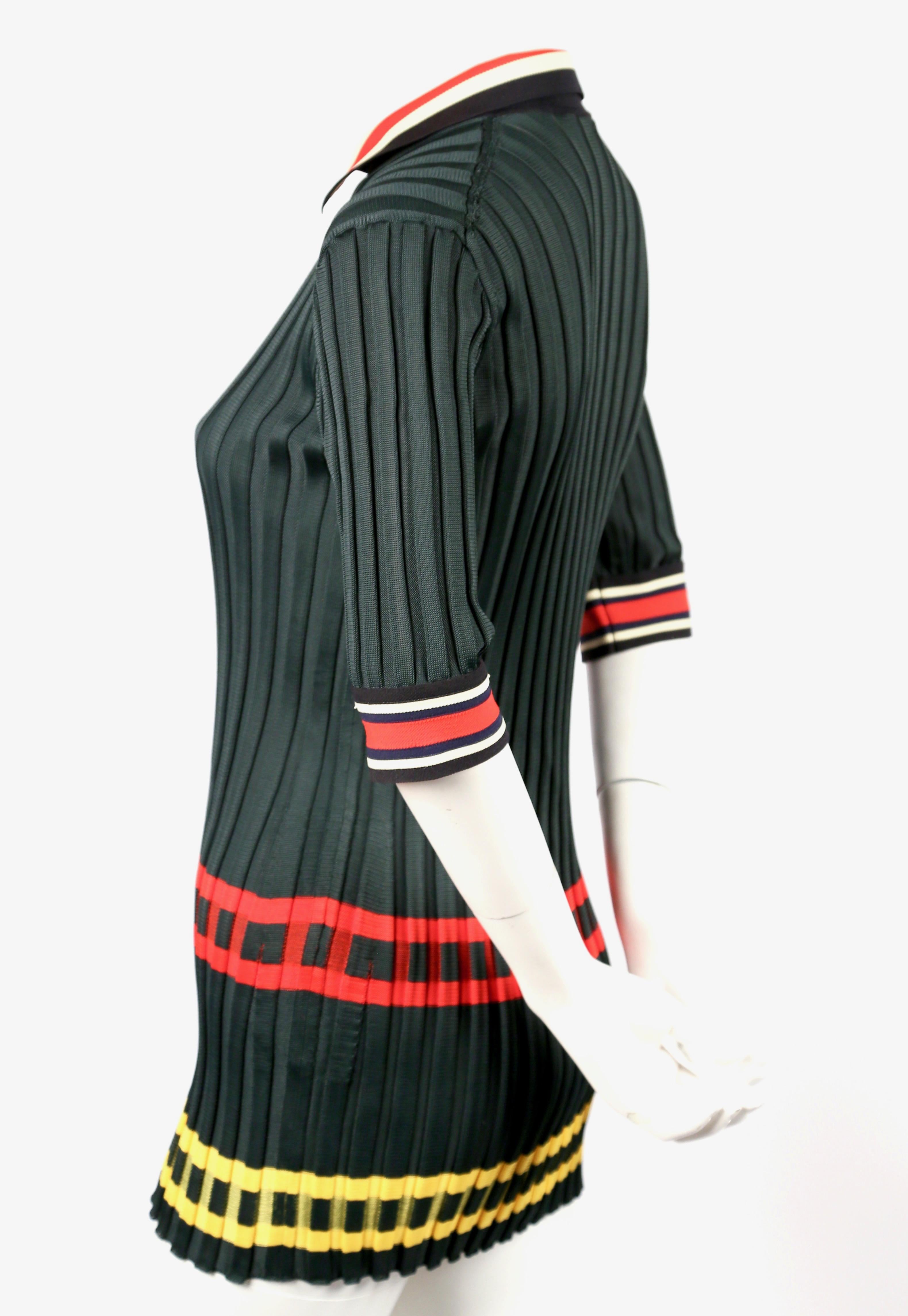 Deep-green, ribbed tunic with red and yellow stripes designed by Phoebe Philo for Celine dating to spring of 2014, exactly as seen on the runway. French size S. Approximate measurements (unstretched): shoulder 12-13