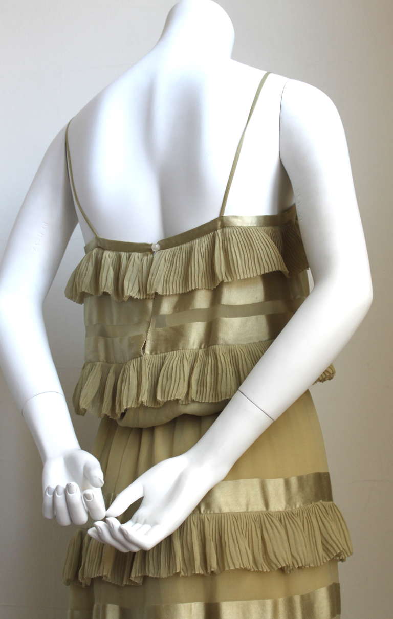 Very unique silk chiffon dress with woven satin stripes and hand pleated ruffles designed by Karl Lagerfeld for Chloe dating to the 1970's. Fits a size 4- 6. approximate measurements: bust 32-33", waist 25" (elastic), hips 35" and