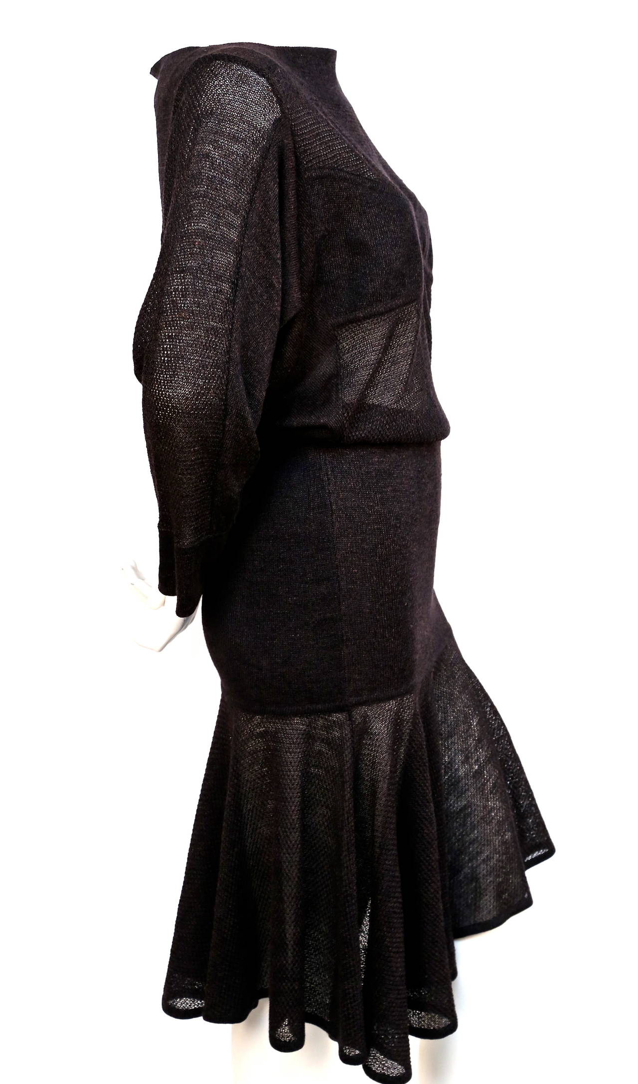 Very rare deep brown knit dress with sheer illusion panels from Azzedine Alaia dating to the 1980's. Size 'S'. Pulls on over the head. Made in Italy. Excellent condition.