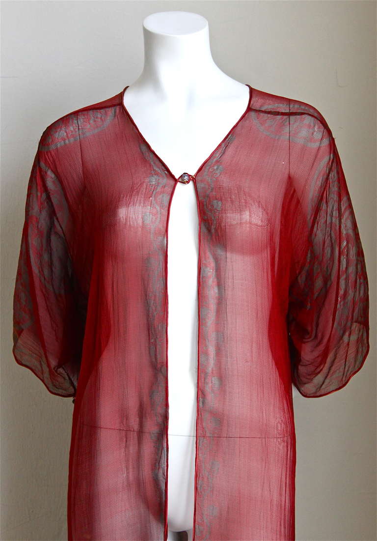 Very rare red cochineal dye silk gauze printed jacket with an ancient middle eastern "Tree of Life" motif with meandering vines borders from Mariano Fortuny dating to the 1920's. Original silk satin cording with striped Venetian glass