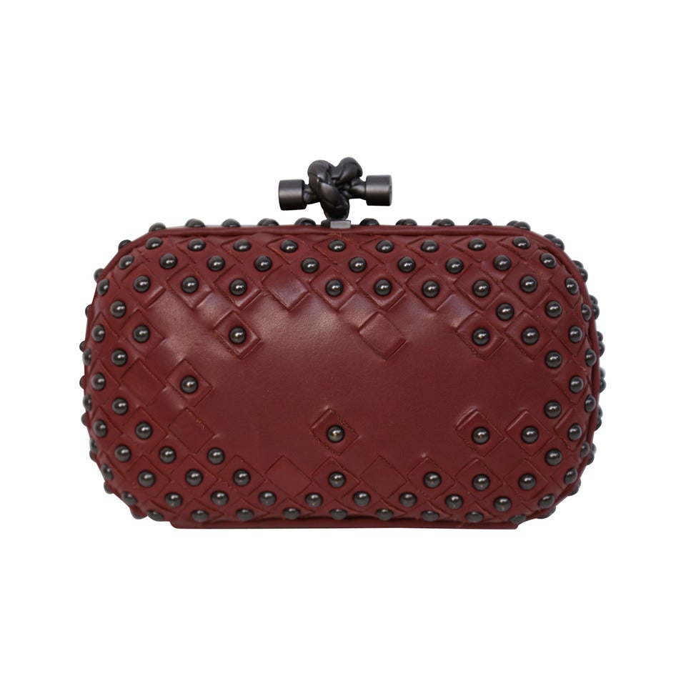 BOTTEGA VENETA gunmetal studded intrecciato leather knot clutch