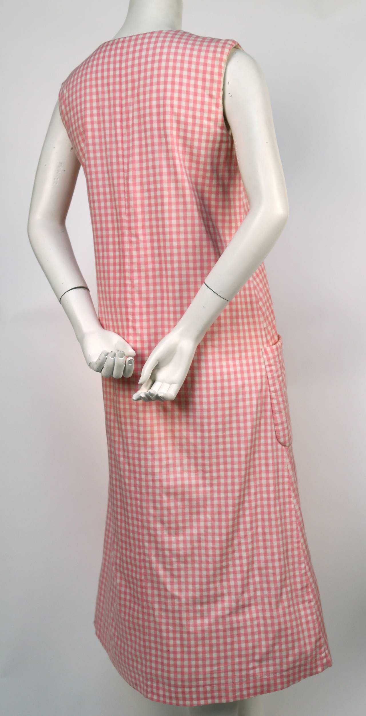 Pink gingham cotton dress with padding at shoulders and hem from Comme Des Garcons dating to the 1997 Lumps and Bumps collection. Size 'M'. Approximate measurements: bust 36