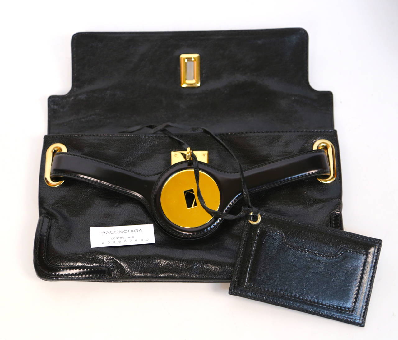 BALENCIAGA black leather &#39;Lune&#39; clutch bag with gold hardware at 1stdibs