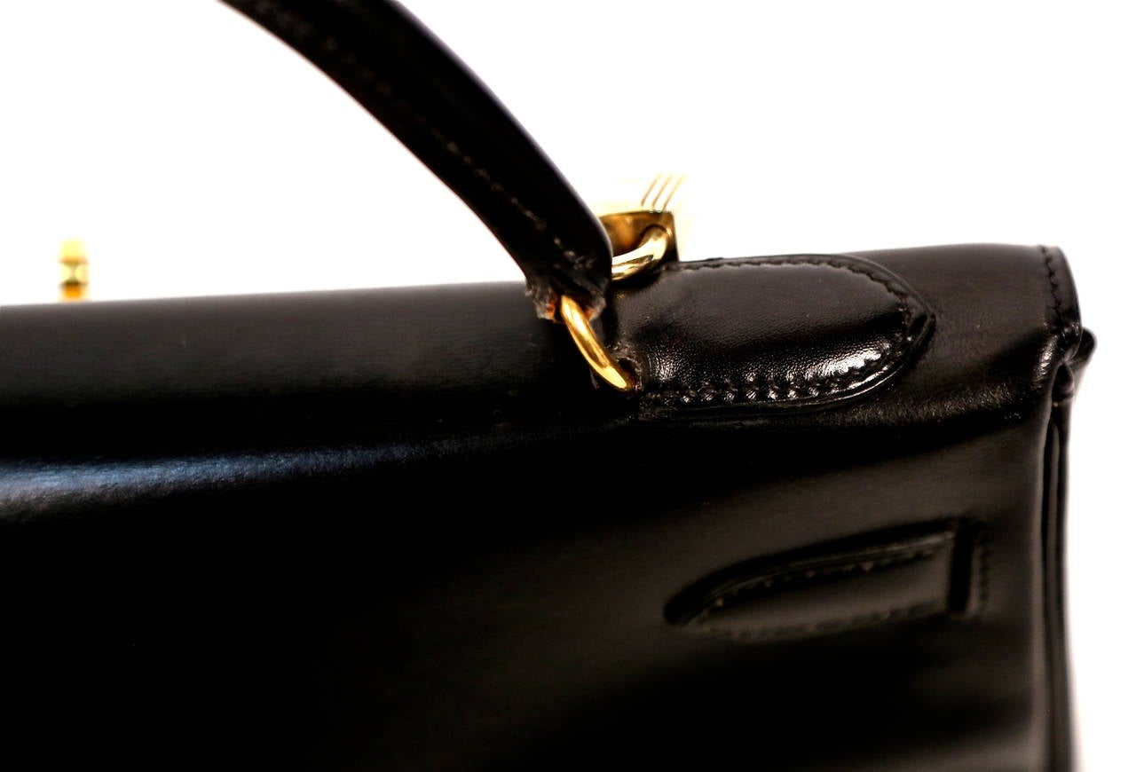 Women's HERMES KELLY retourne 32 cm black veau box leather with canvas shoulder strap