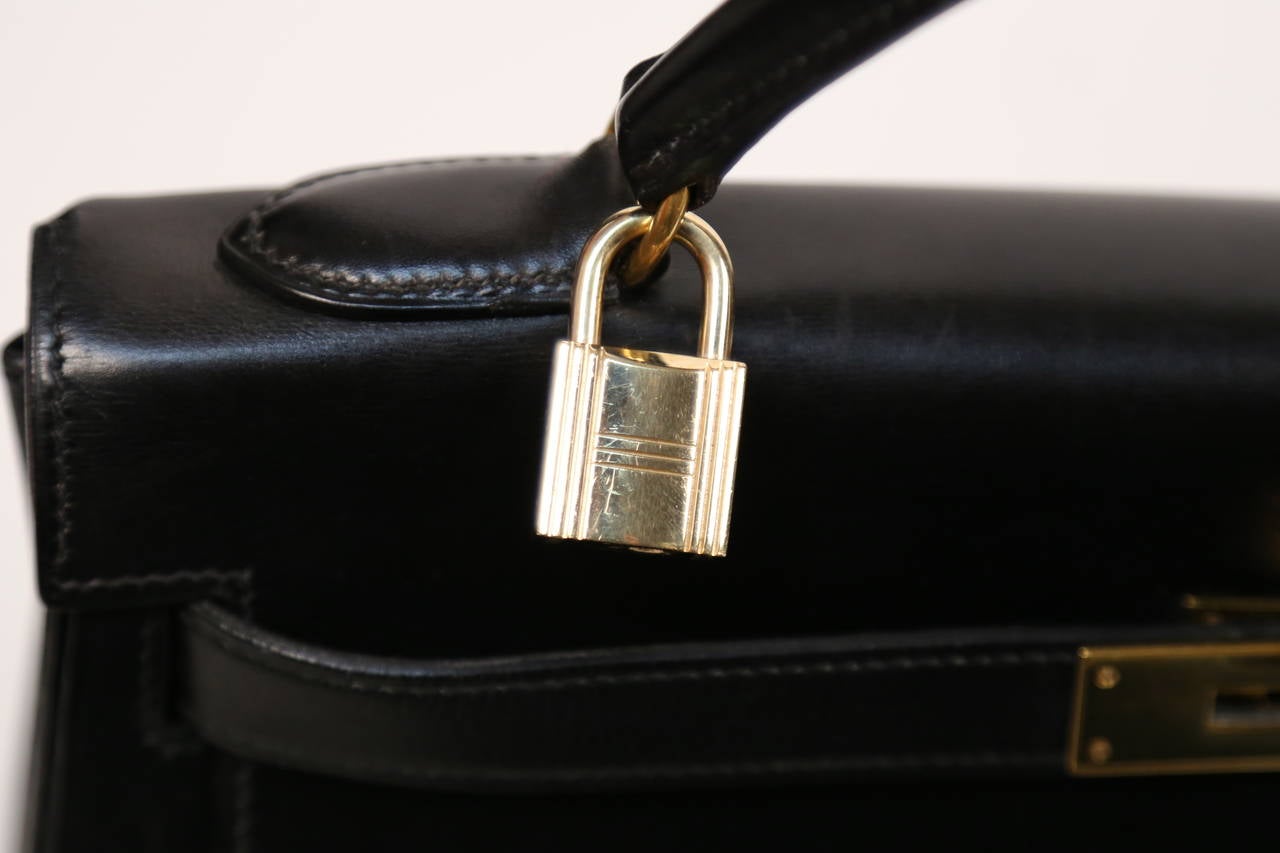 HERMES KELLY retourne 32 cm black veau box leather with canvas shoulder strap 1