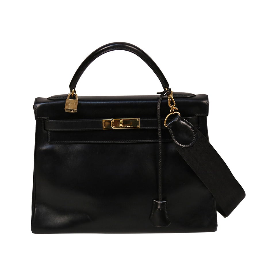 HERMES KELLY retourne 32 cm black veau box leather with canvas shoulder strap