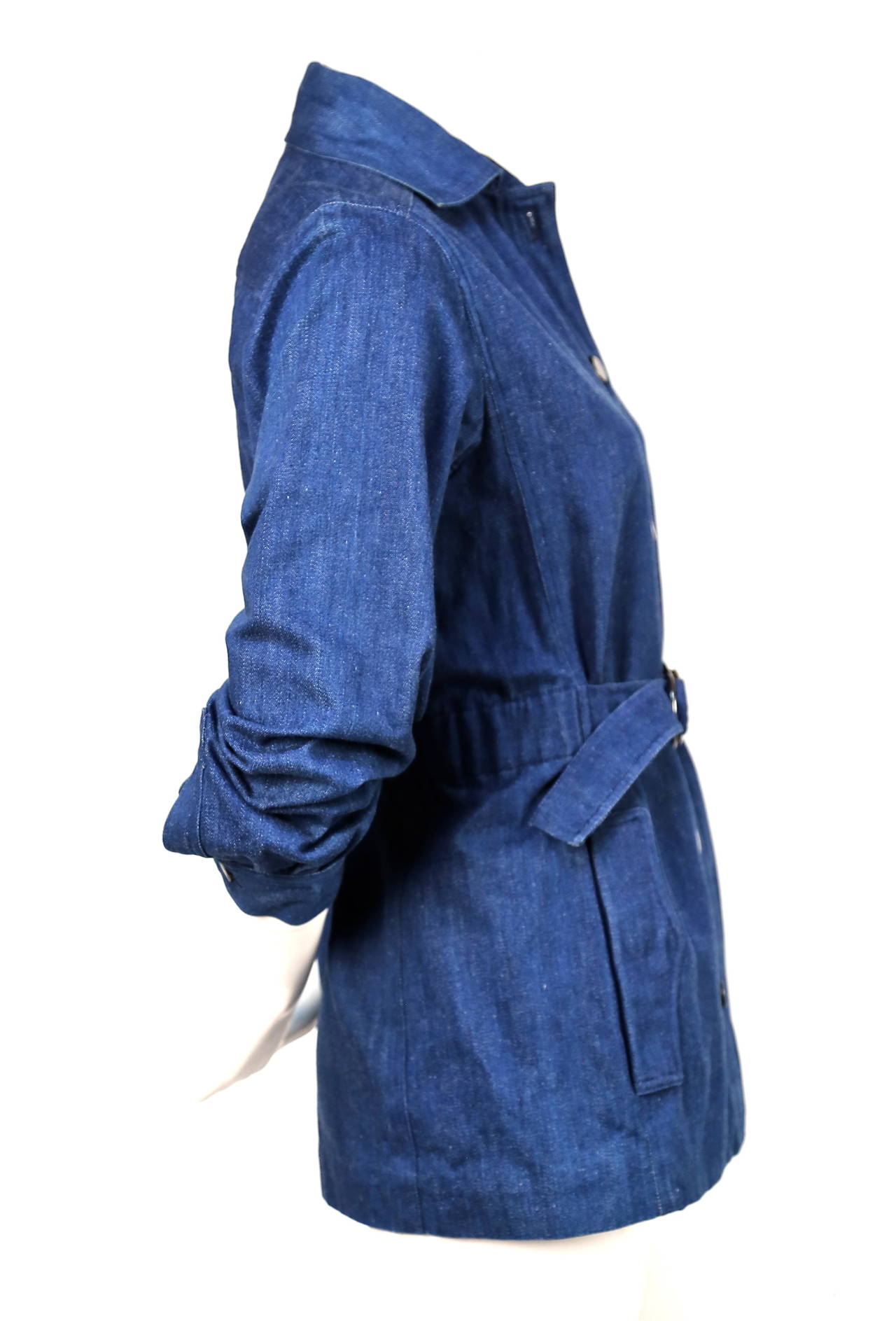 Medium blue denim safari style jacket designed by Yves Saint Laurent dating to the early 1970's. Jacket best fits a US 4 or 6. Approximate measurements: 14.25
