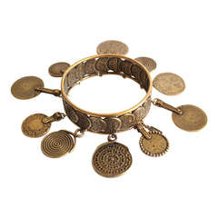 1977 YVES SAINT LAURENT antique brass cuff with coins
