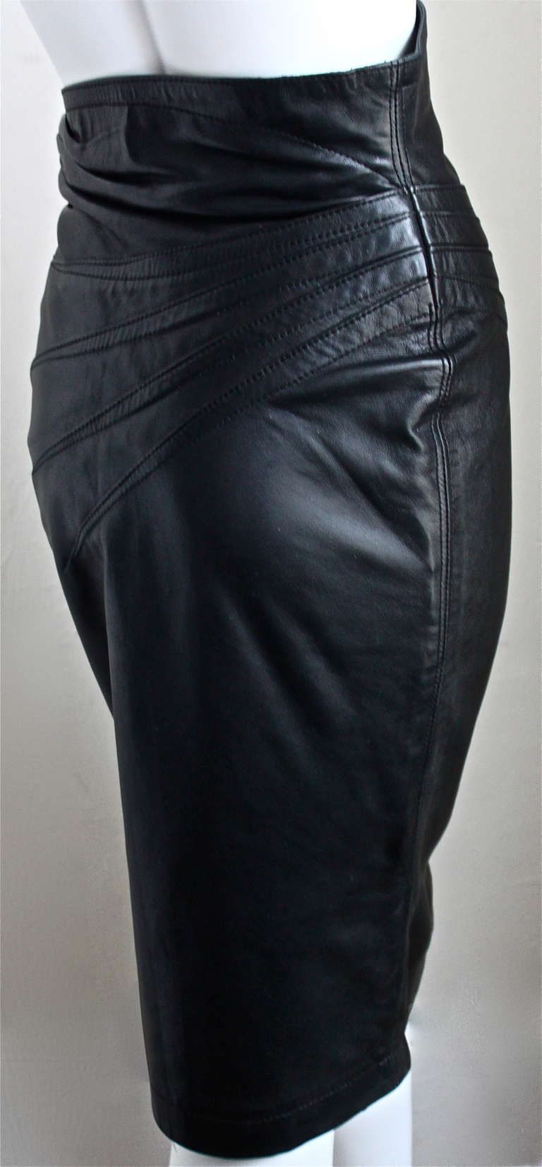 Women's 1990's AZZEDINE ALAIA black leather skirt with side buckle