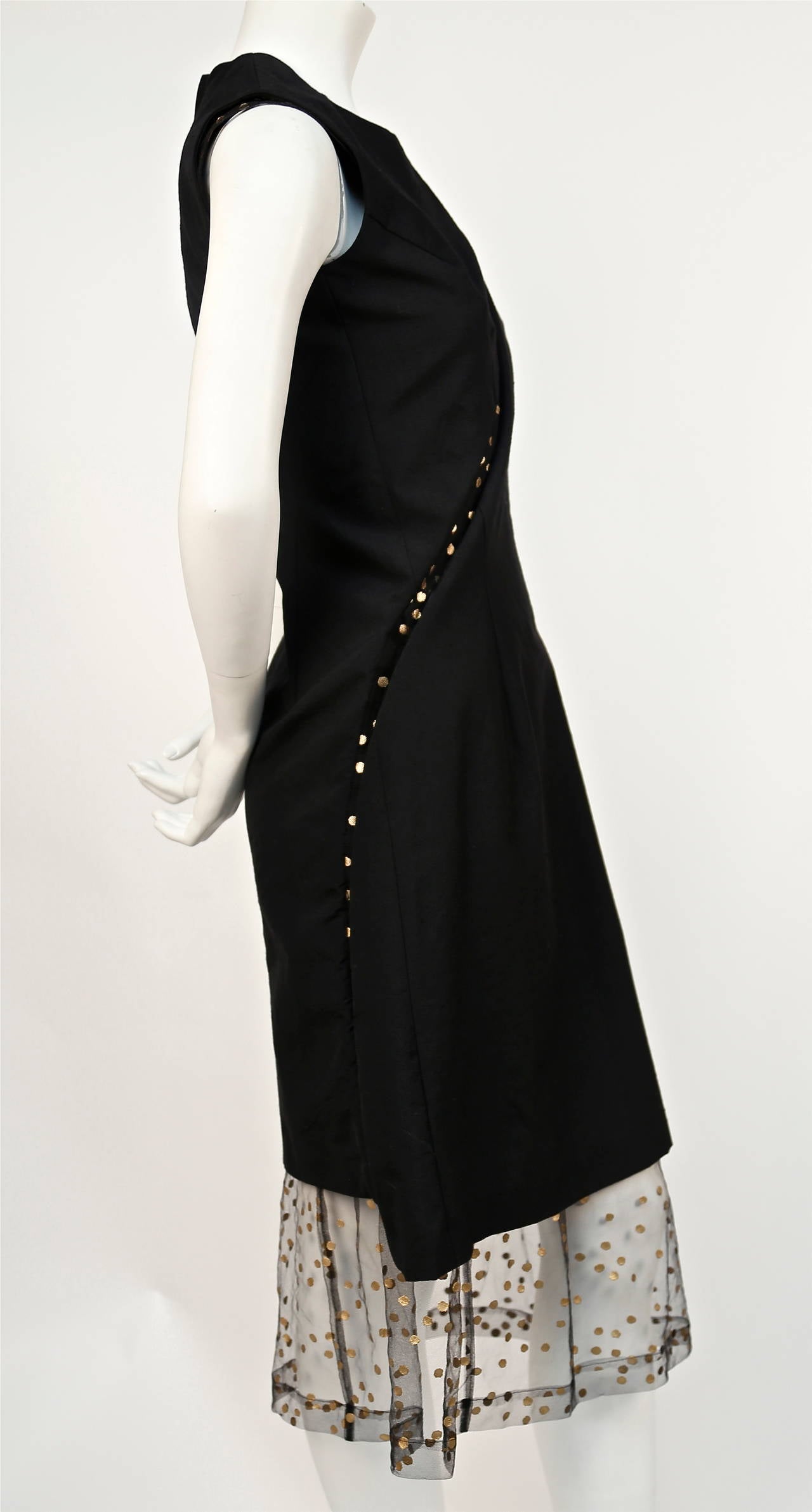 Very rare black dress with metallic gold dotted tulle from Comme Des Garcons dating to fall of 1997 as seen on the runway. Size 'S'. Approximate measurements: bust 33.5