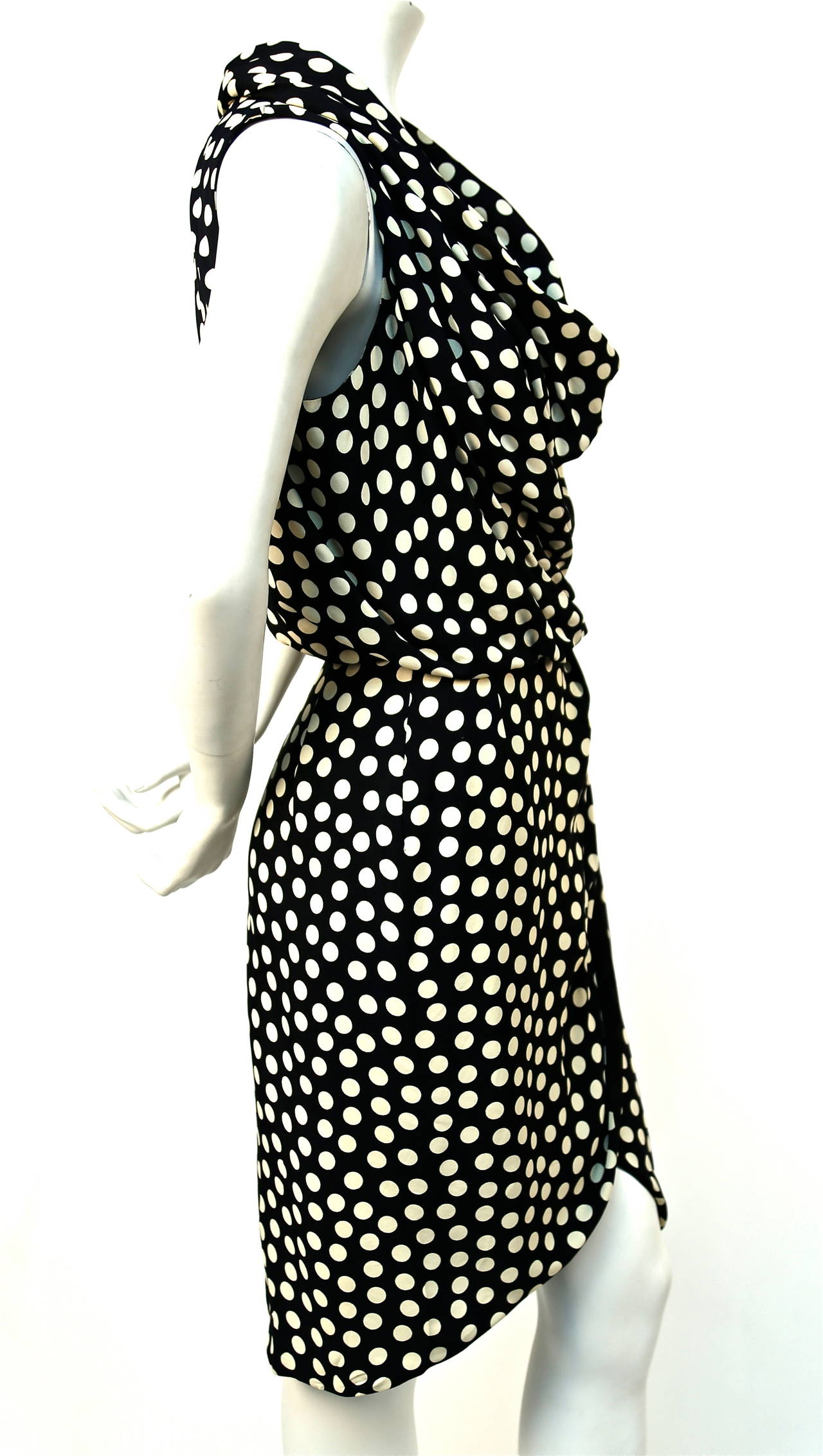 Draped black and cream silk dress with cowl neckline and asymmetrical hemline from Christian Lacroix Luxe dating to the 1990's. Dress best fits a US 8 or 10  (29