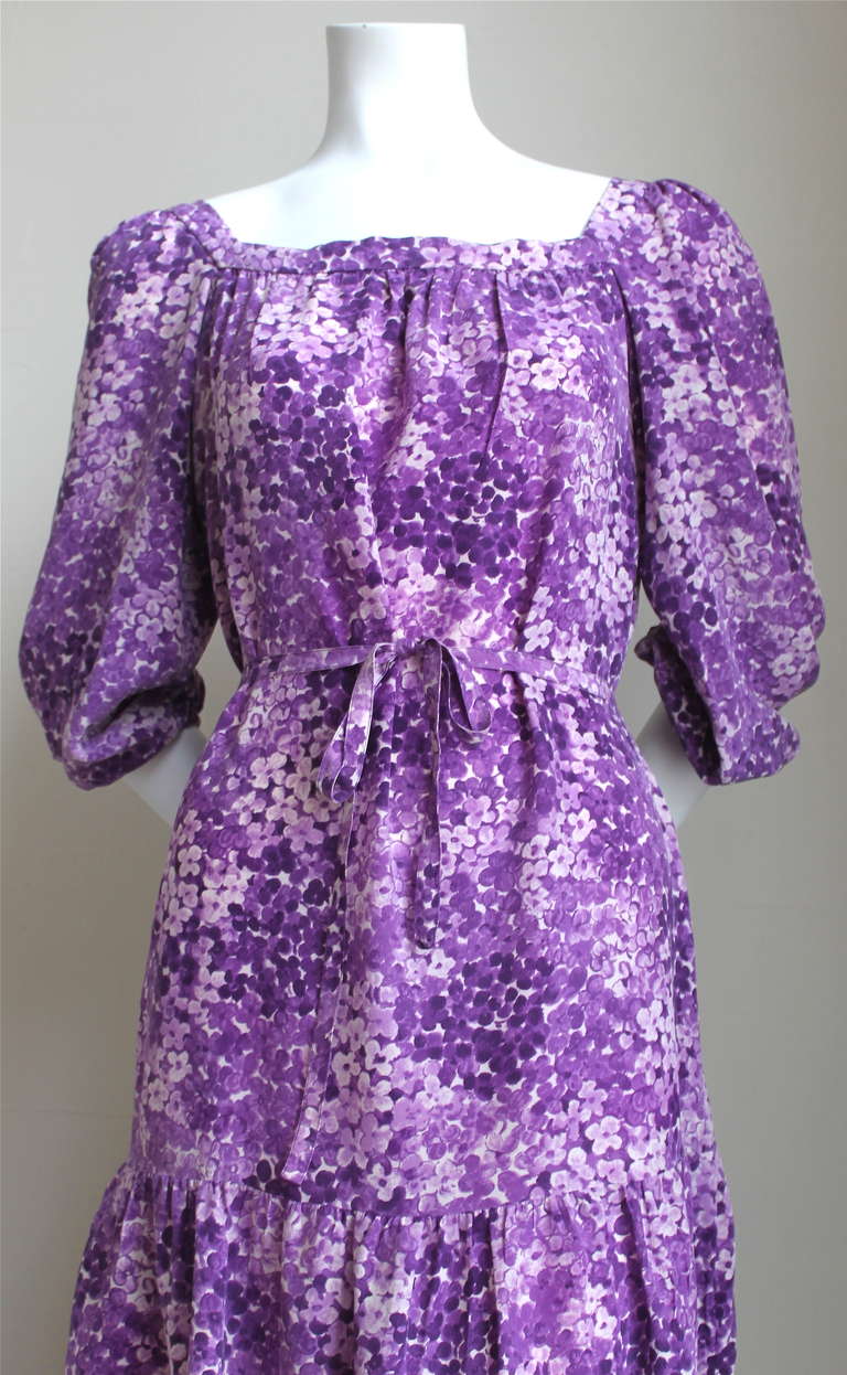 Classic silk floral peasant dress with matching belt from Yves Saint Laurent dating to the 1970's. No size indicated however this dress best fits a size 4-6. Shoulder 13-14