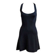 AZZEDINE ALAIA black dress with open back and flared skirt