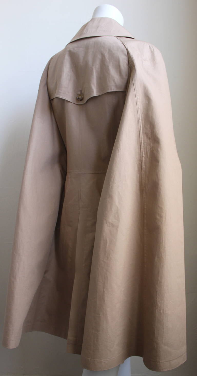 Very unique tan cotton trench cape designed by Junya Watanabe exactly as seen on the runway for spring of 2012. Labeled a size 'M'. Approximate measurements: shoulder 15