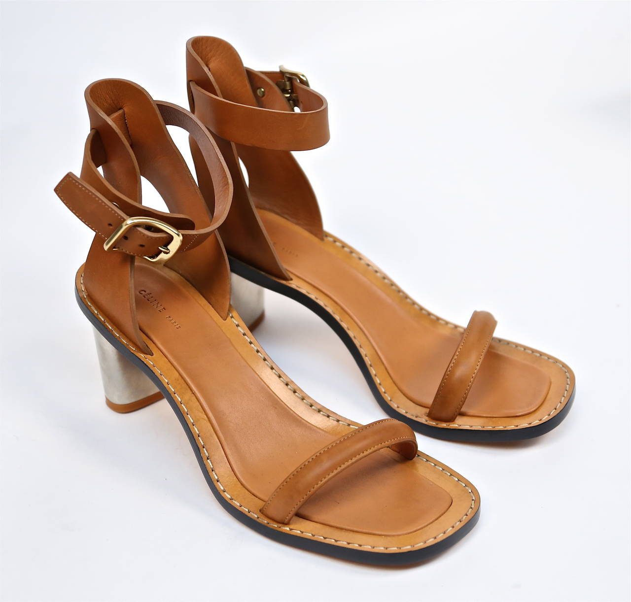 Tan leather bam bam sandals with silver metal heels from Celine. French size 40. Insoles measure approximately 10.5