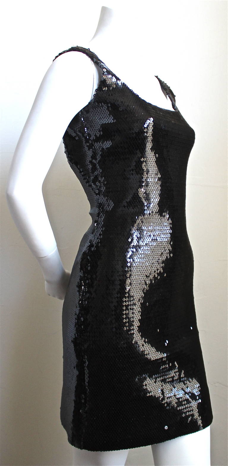Very rare jet black sequined mini dress from Stephen Sprouse dating to the 1980's. Labeled a US size 6. Approximate measurements: bust 32.5