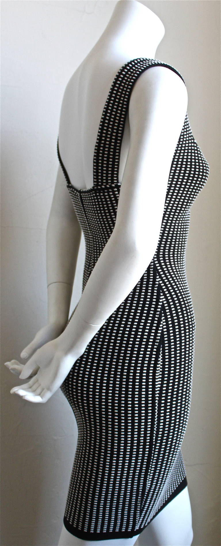 Very rare black and white textured mini dress from Azzedine alaia dating to the 1990's. Labeled a size 'm' however this dress fits a small. Approximate measurements are: bust 30
