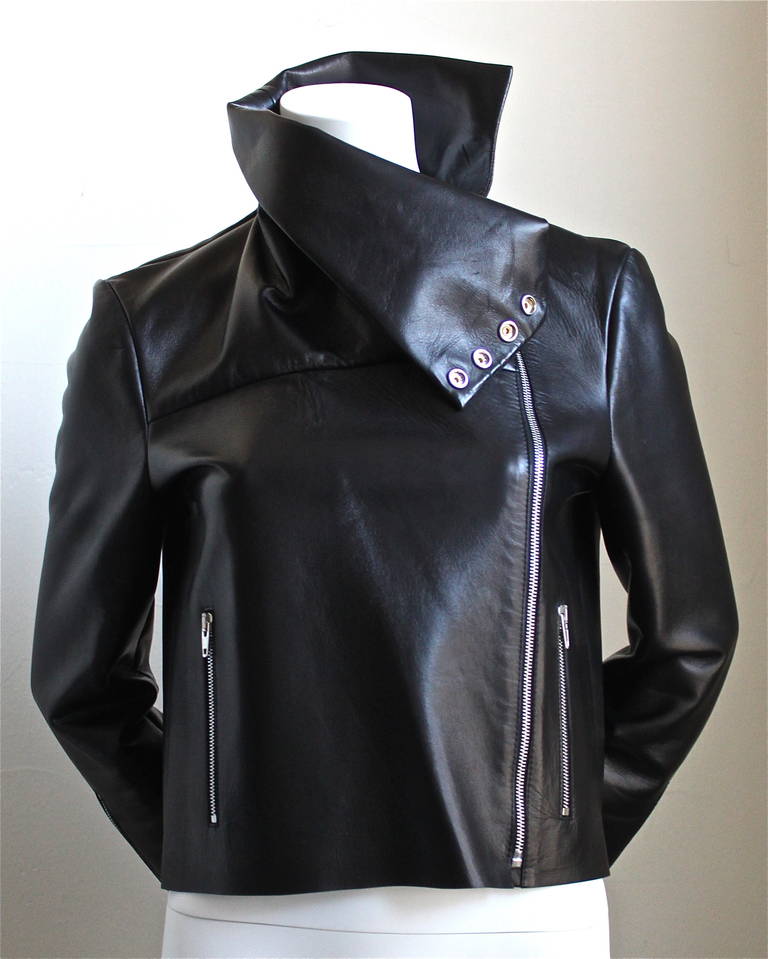 Jet black 60's style leather jacket from Celine designed by Phoebe Philo. Jacket is labeled a French size 38. Approximate measurements: Bust 36
