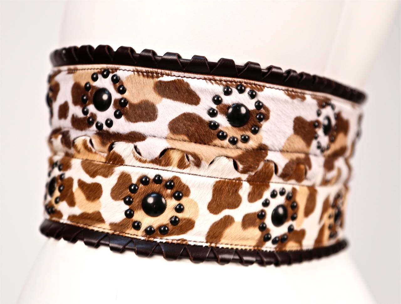 Extra wide leopard printed calf hair belt with studded detail and triple buckle closure from Azzedine Alaia. French size 70. Belt measures just under 4.75
