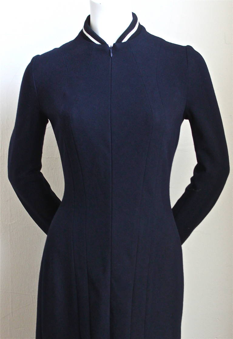 Navy blue seamed wool dress with striped collar and long zippers designed by Yohji Yamamoto as seen on the runway for fall of 2001. This dress exemplifies Yamamoto's early Adidas influenced work and it predates his Y-3 line. Dress is labeled a size