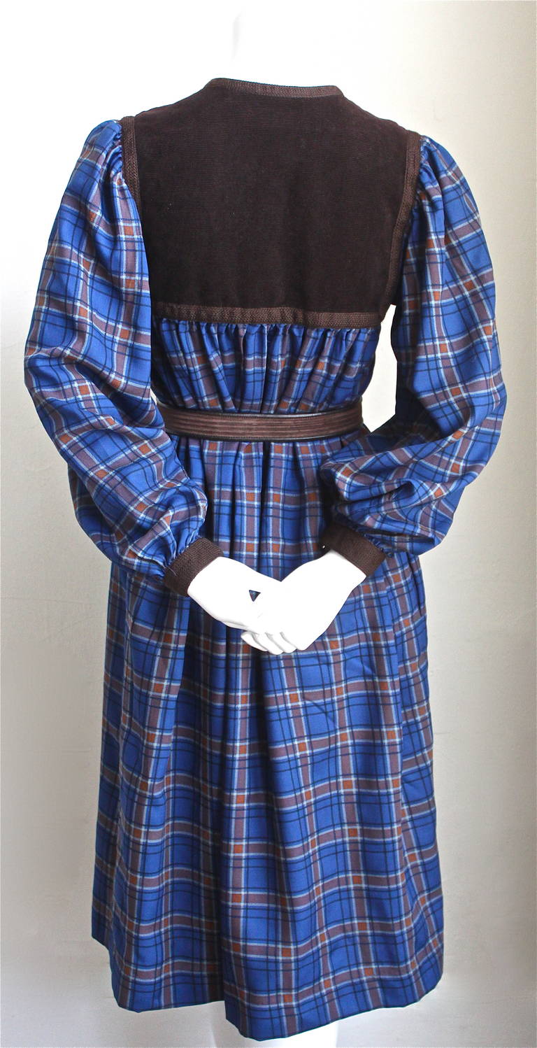 Blue and brown plaid wool peasant dress with brown corduroy from Yves Saint Laurent dating to the early 1980's. Dress fits a size 2 to 6 (narrow in shoulders and bust). Approximate measurements: shoulders 15
