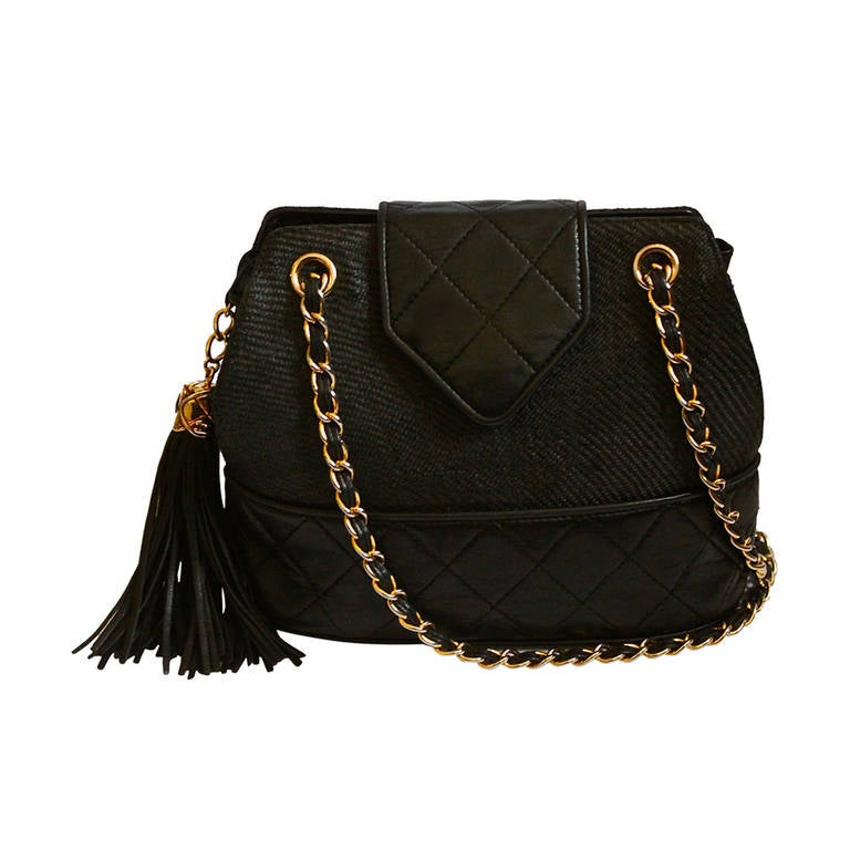 1989 CHANEL black raffia and quilted leather bag with gilt chain & tassel