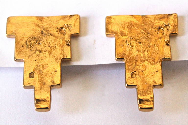 Gilt geometric shaped clip earrings with organic finish from Yves Saint Laurent dating to the 1990's. Earrings measure just over 1