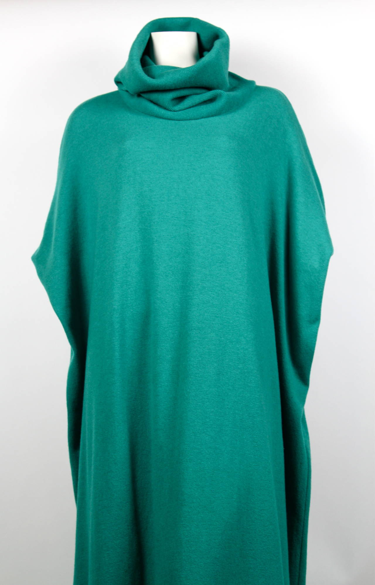 Very rare and unusual turquoise green rectangular shaped knit dress from Jungle Japan dating to the 1970's. Labeled a size 'S'. Approximate measurements: bust 74